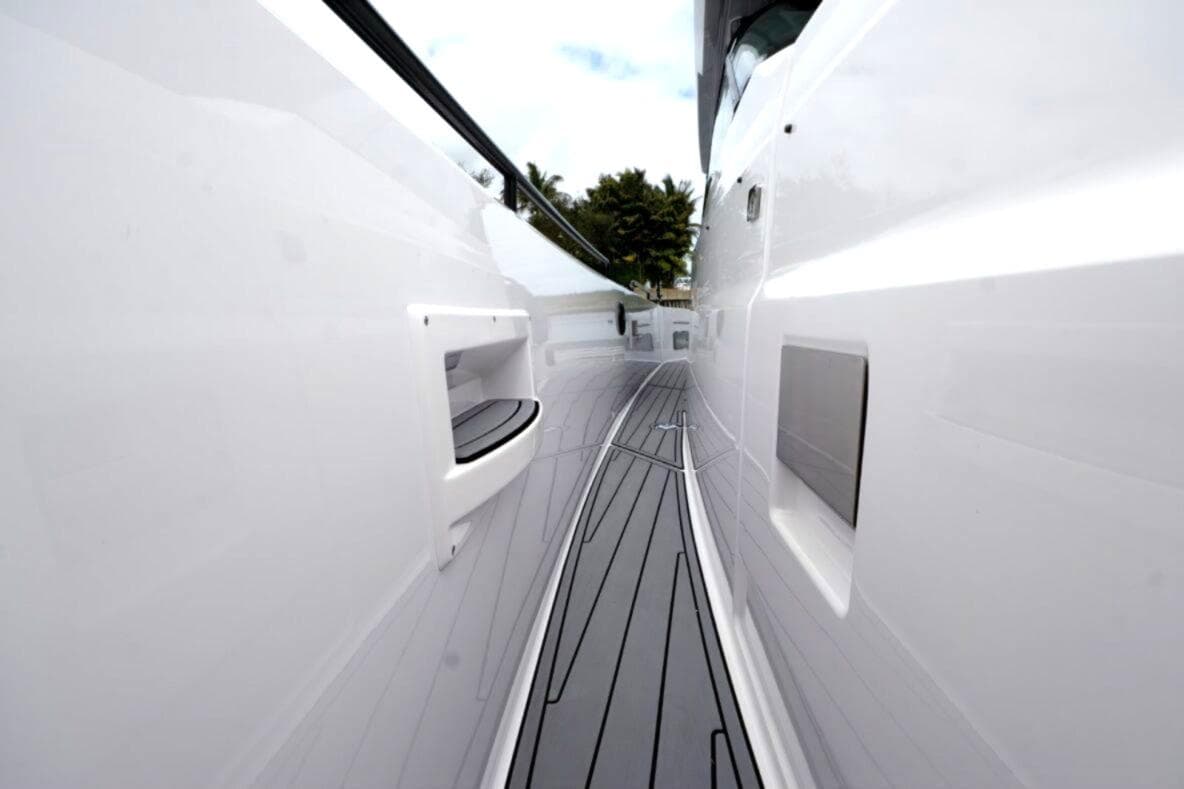 Side view of 2022 Axopar 37 Sun-Top yacht, showcasing sleek design and modern deck.