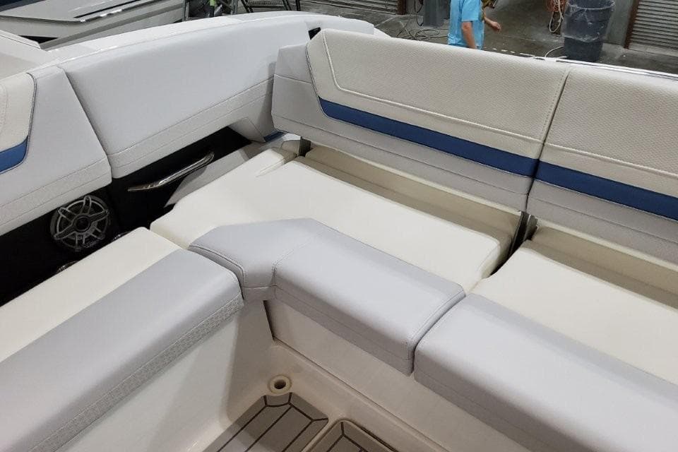2026 Formula 360 Crossover Bowrider I/O interior seating with white and blue upholstery.