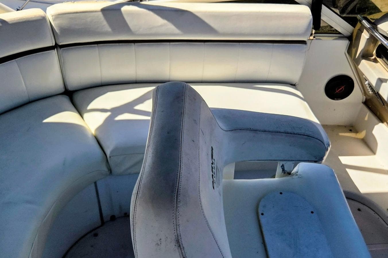 Interior seating of a 2000 Carver 396 Motor Yacht, featuring white upholstery.