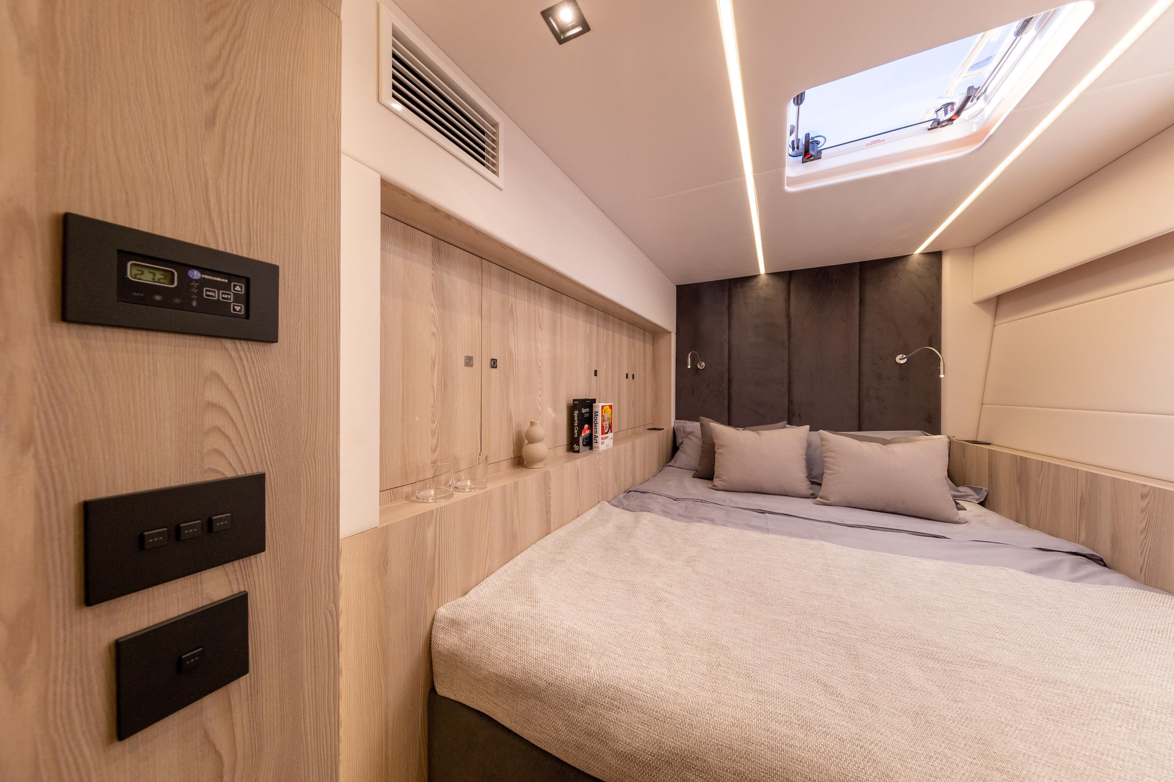 Luxurious Omaya 50 yacht bedroom interior, 2026 model, featuring modern design and ambient lighting.