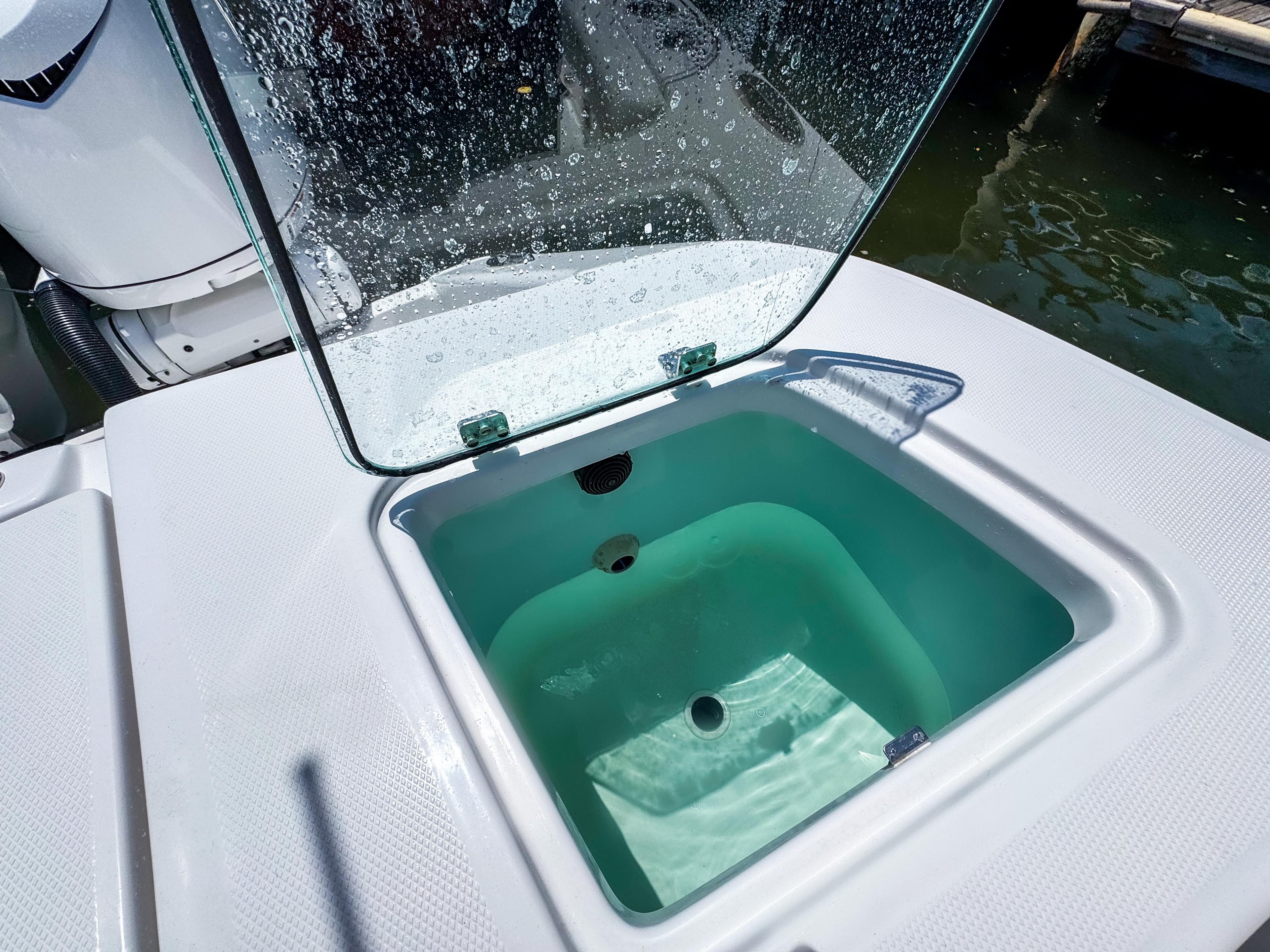 Open livewell on 2025 Edgewater 370CC boat, showcasing clean design and functionality.