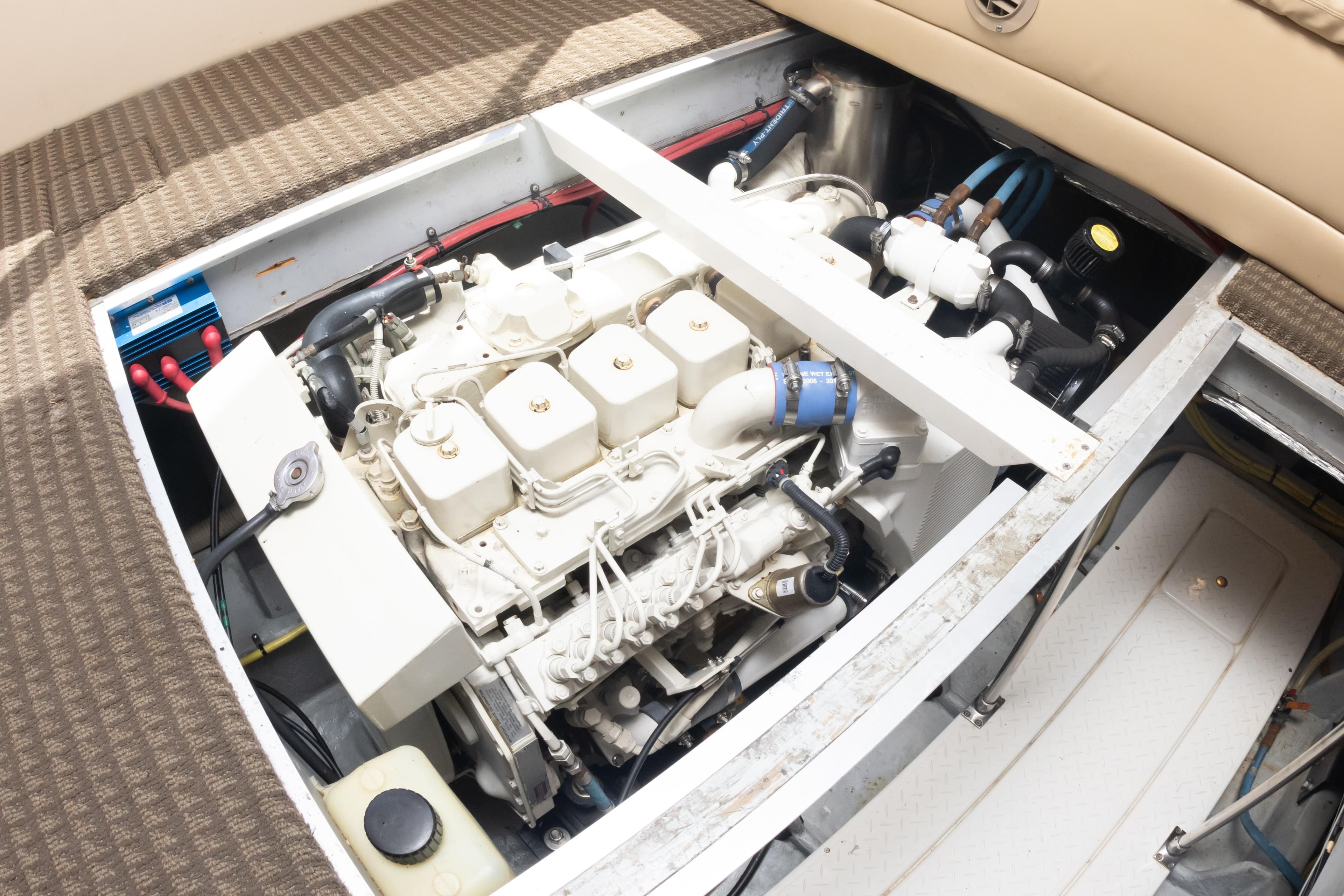 Engine compartment of a 2004 Meridian 490 Pilothouse yacht, showcasing mechanical components.