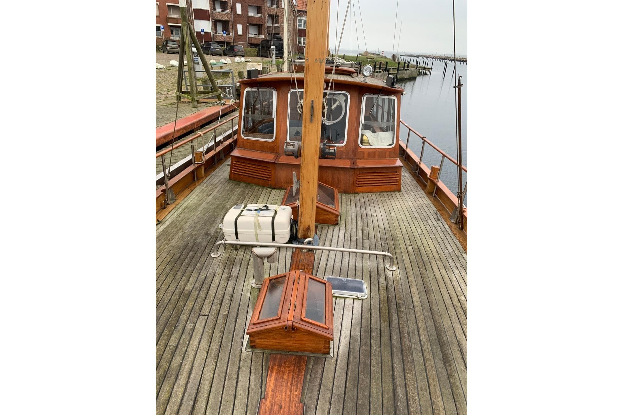 1979 Bueltjer Motorsailer with wooden deck, docked at a marina.