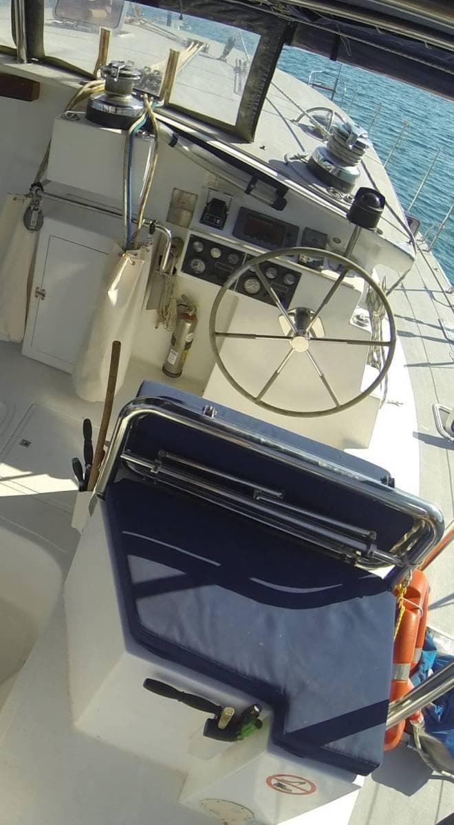 Helm station of 2007 Custom ISoCatamarans 60 with steering wheel and navigation instruments.