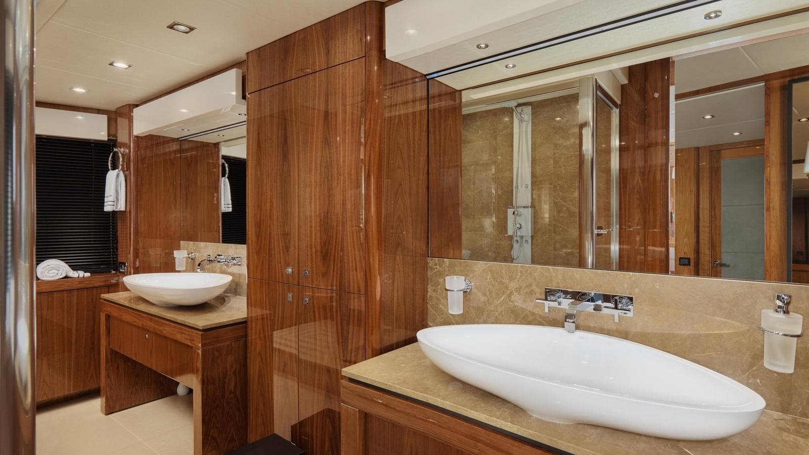Luxurious bathroom interior on 2015 Sunseeker 115 Sport Yacht with elegant wood finishes.