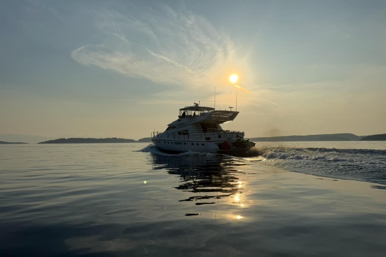 Sunset cruise with 1994 Johnson High-Tech 65 Euro yacht on calm waters.