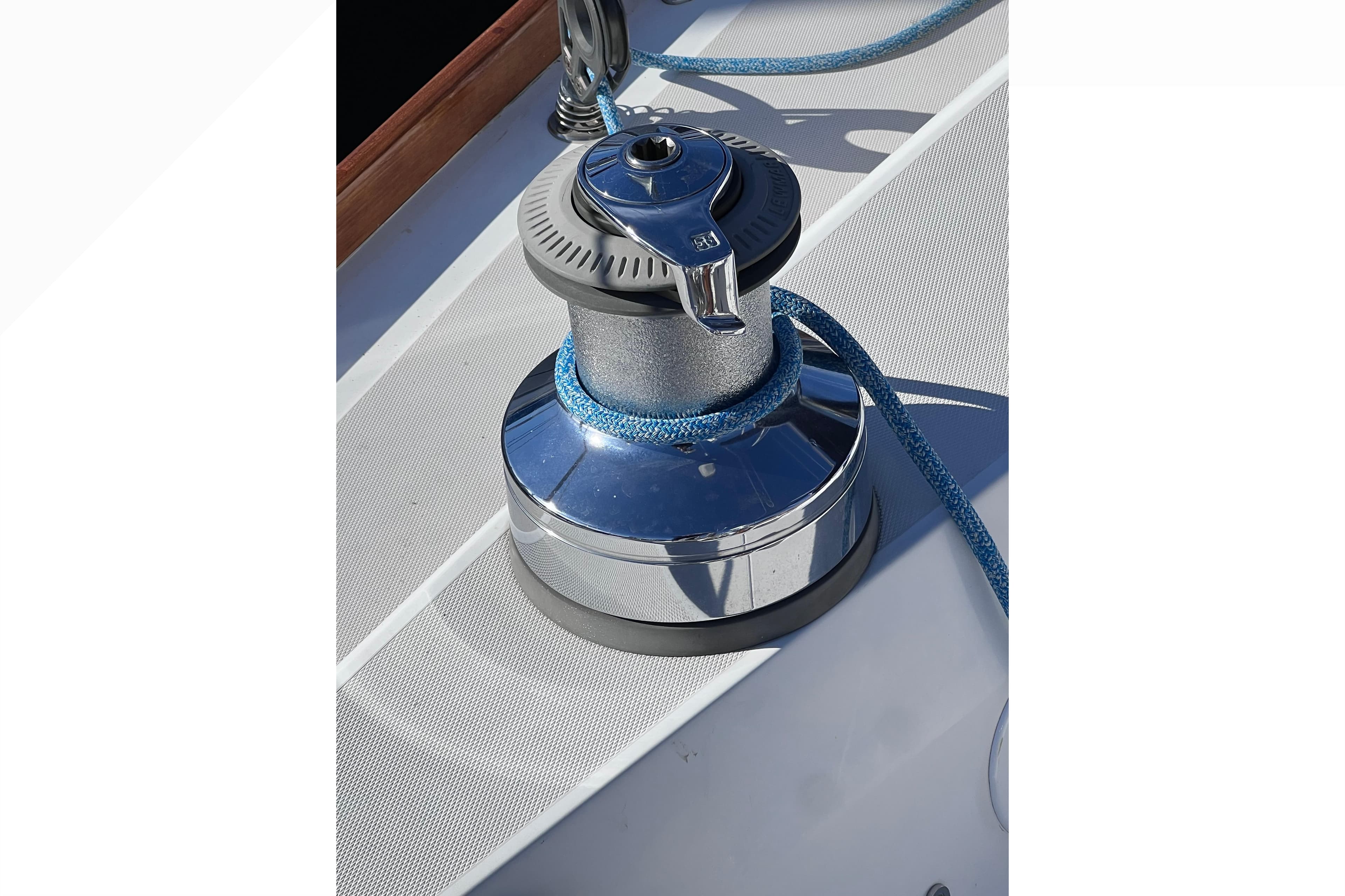 Sailing winch with blue rope on 2006 Sabre 426 yacht deck.