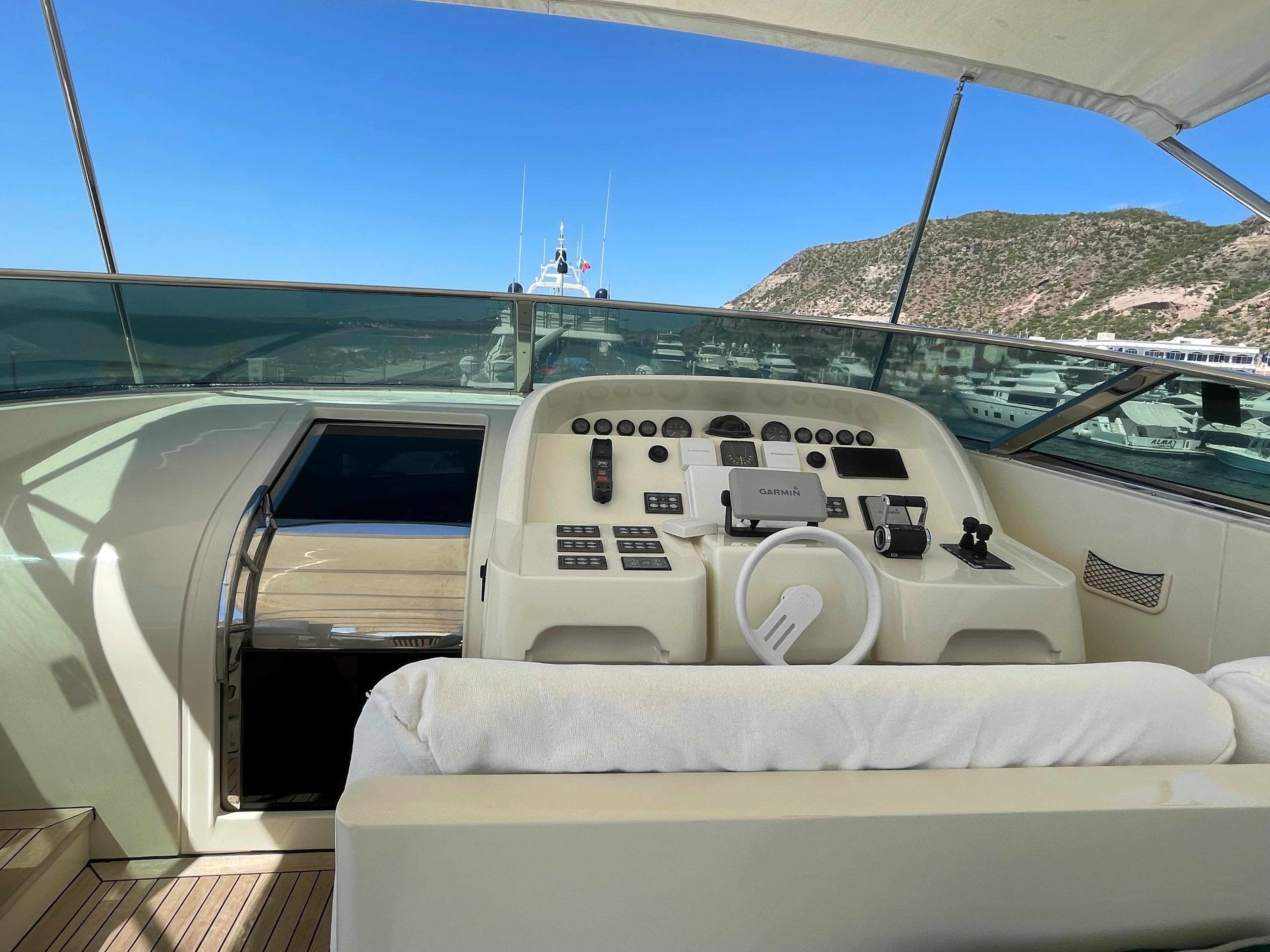 Helm of Posillipo Technema 95 yacht, 2007 model, with mountain view.