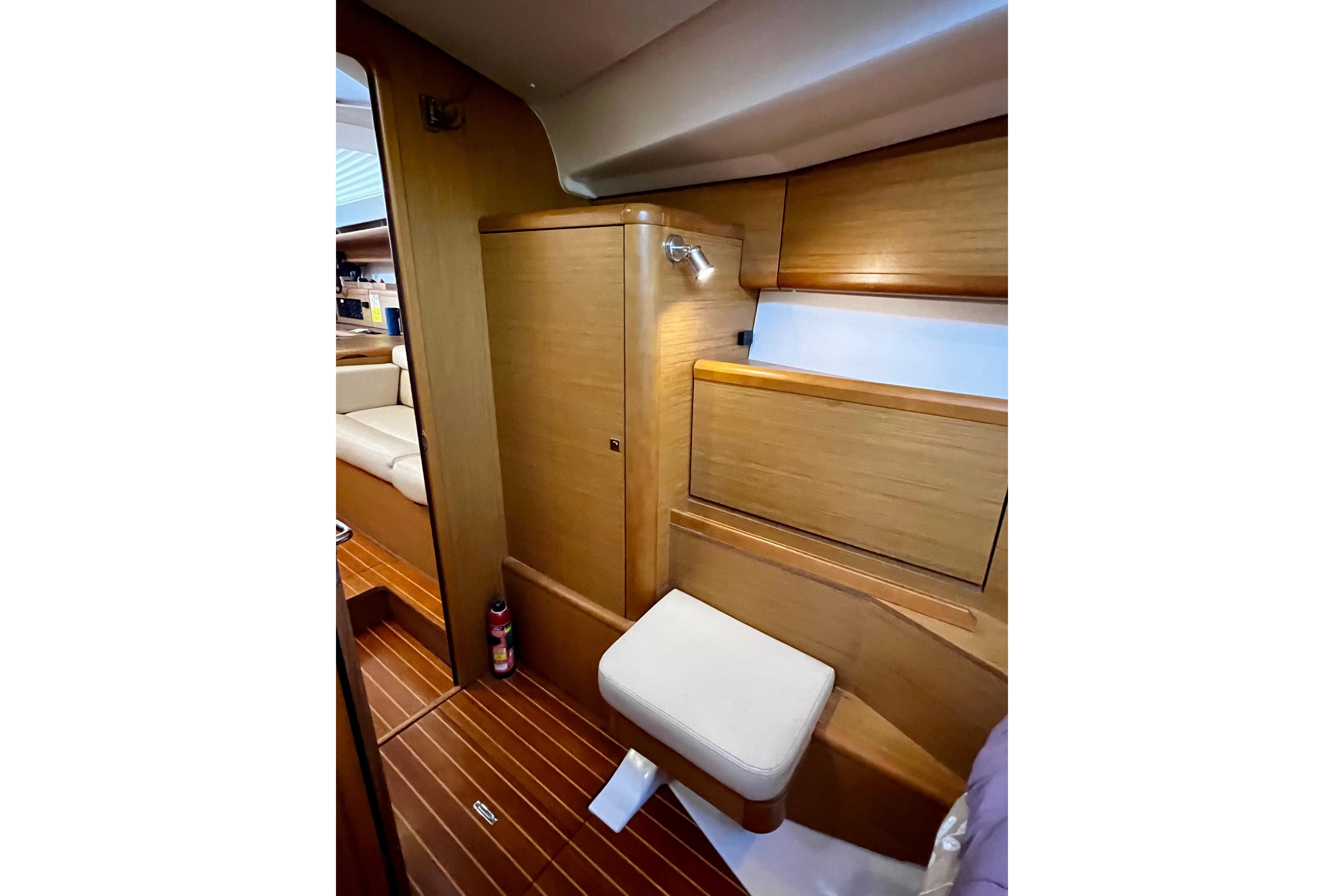 Interior of 2008 Jeanneau Sun Odyssey 45 DS, featuring wooden cabinetry and seating.