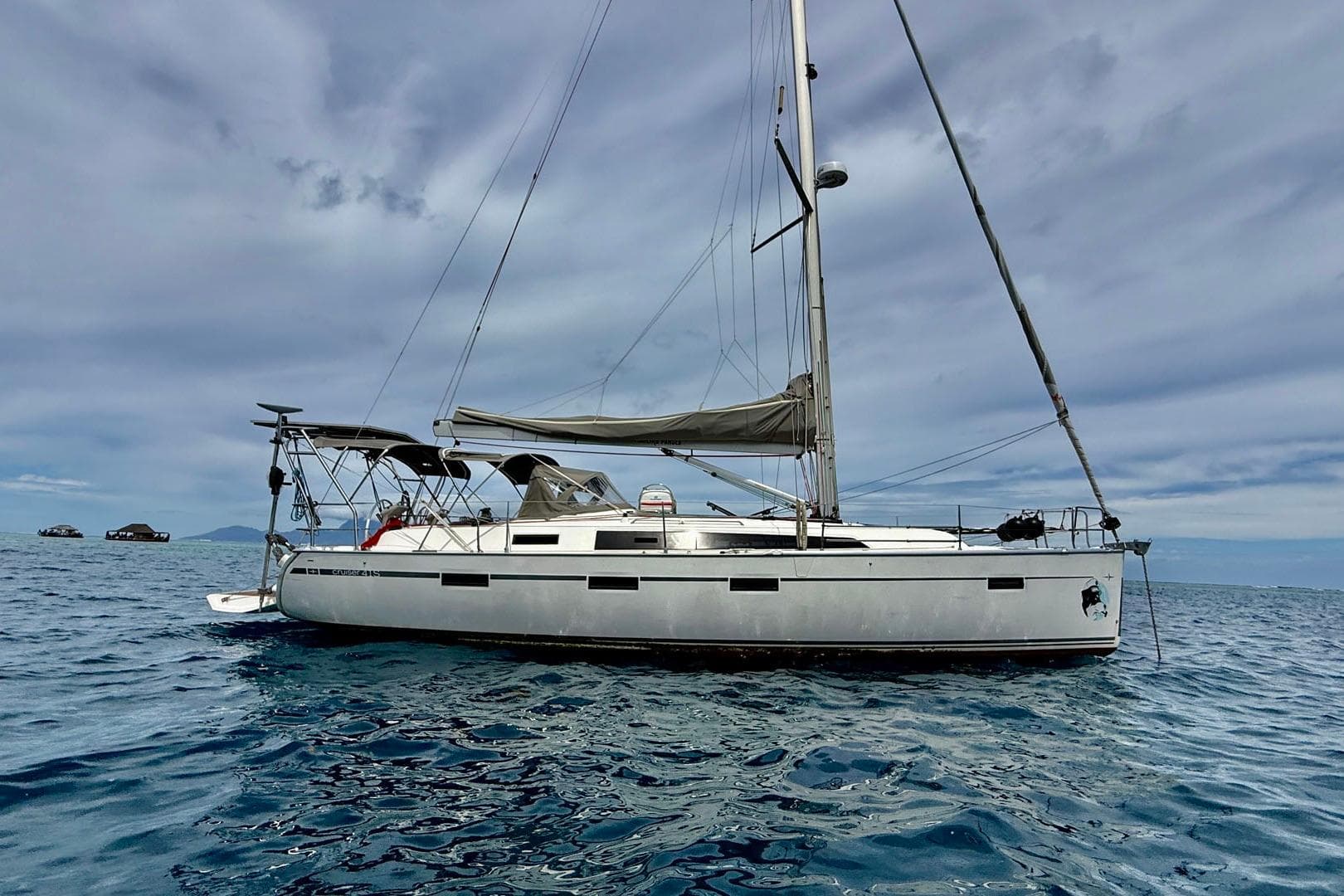 2017 Bavaria Cruiser 41S sailboat on open sea under cloudy sky.