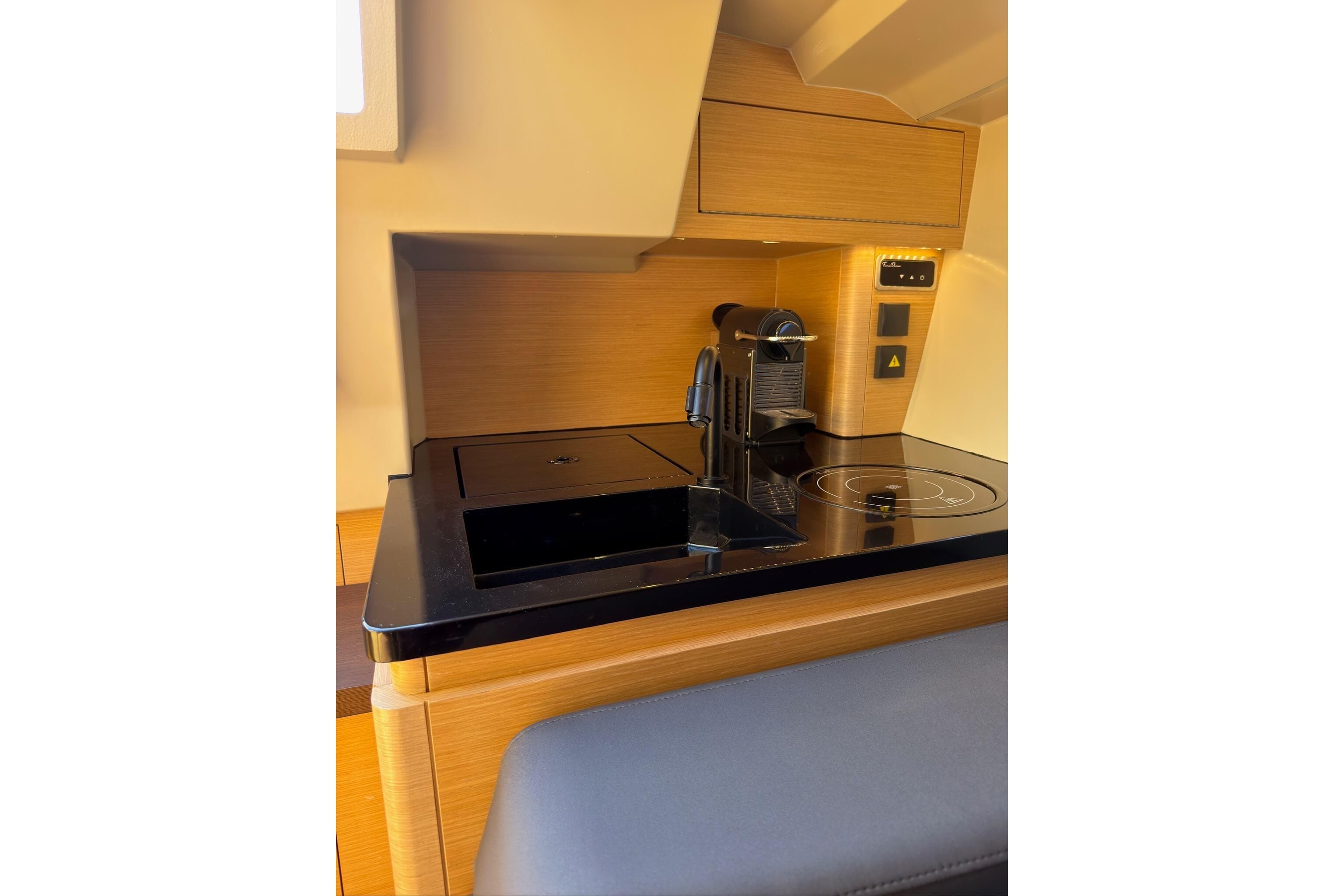 Modern kitchen area in 2022 Saffier SE 33 Life yacht with coffee maker and stove.