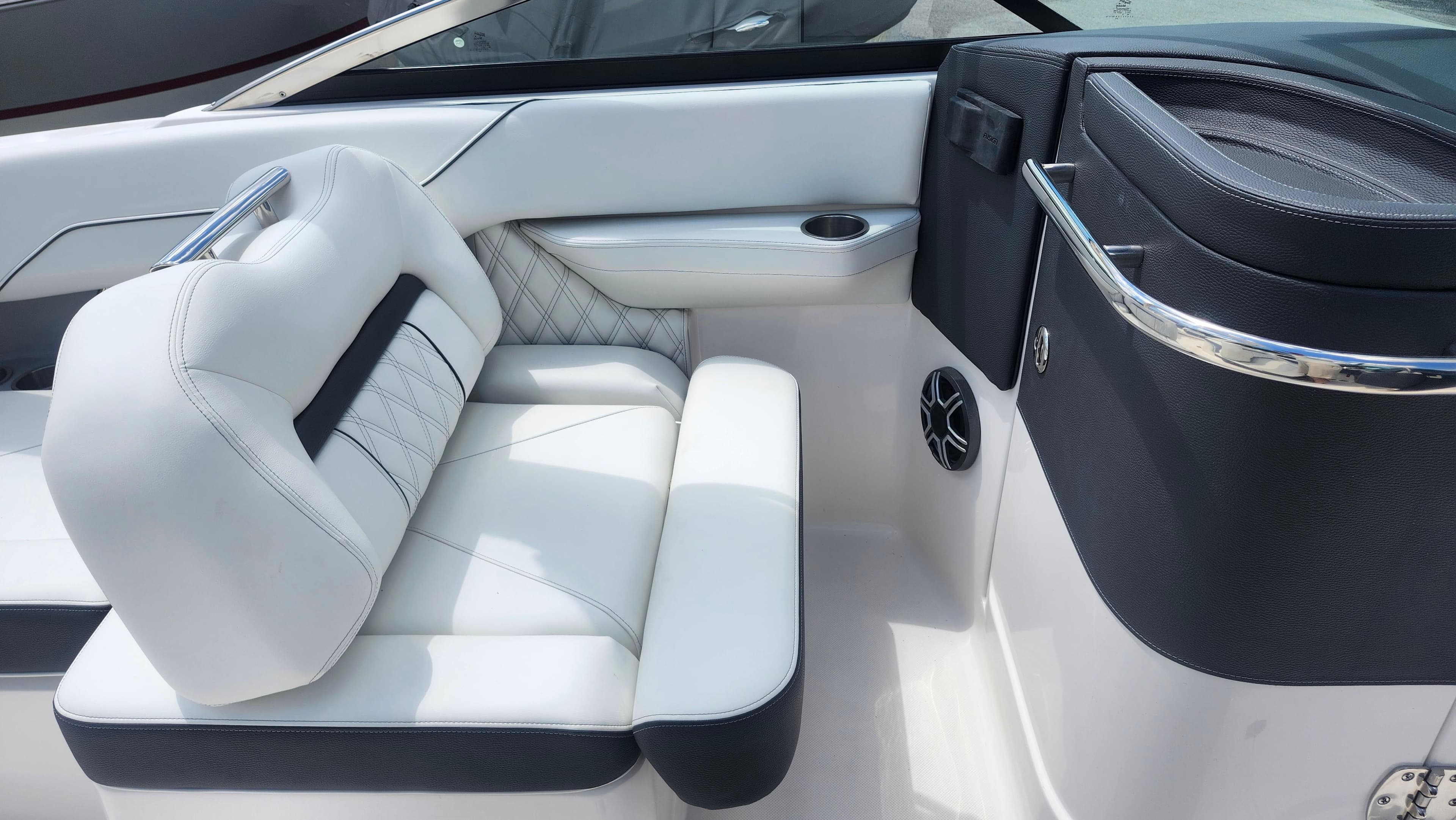 Luxurious white seating in a 2026 Regal LX4 boat interior.