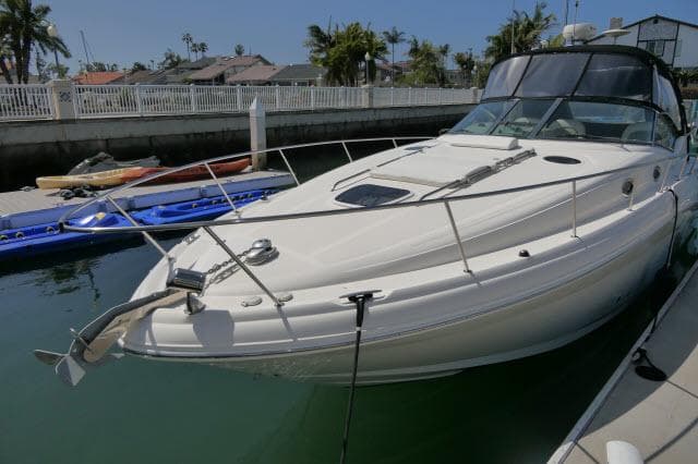 2005 Sea Ray 340 Sundancer docked in a sunny marina setting.