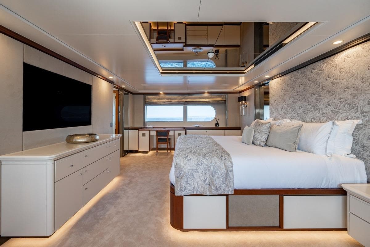 Luxurious bedroom interior on 2001 CRN Magnifica yacht, featuring elegant decor and modern amenities.