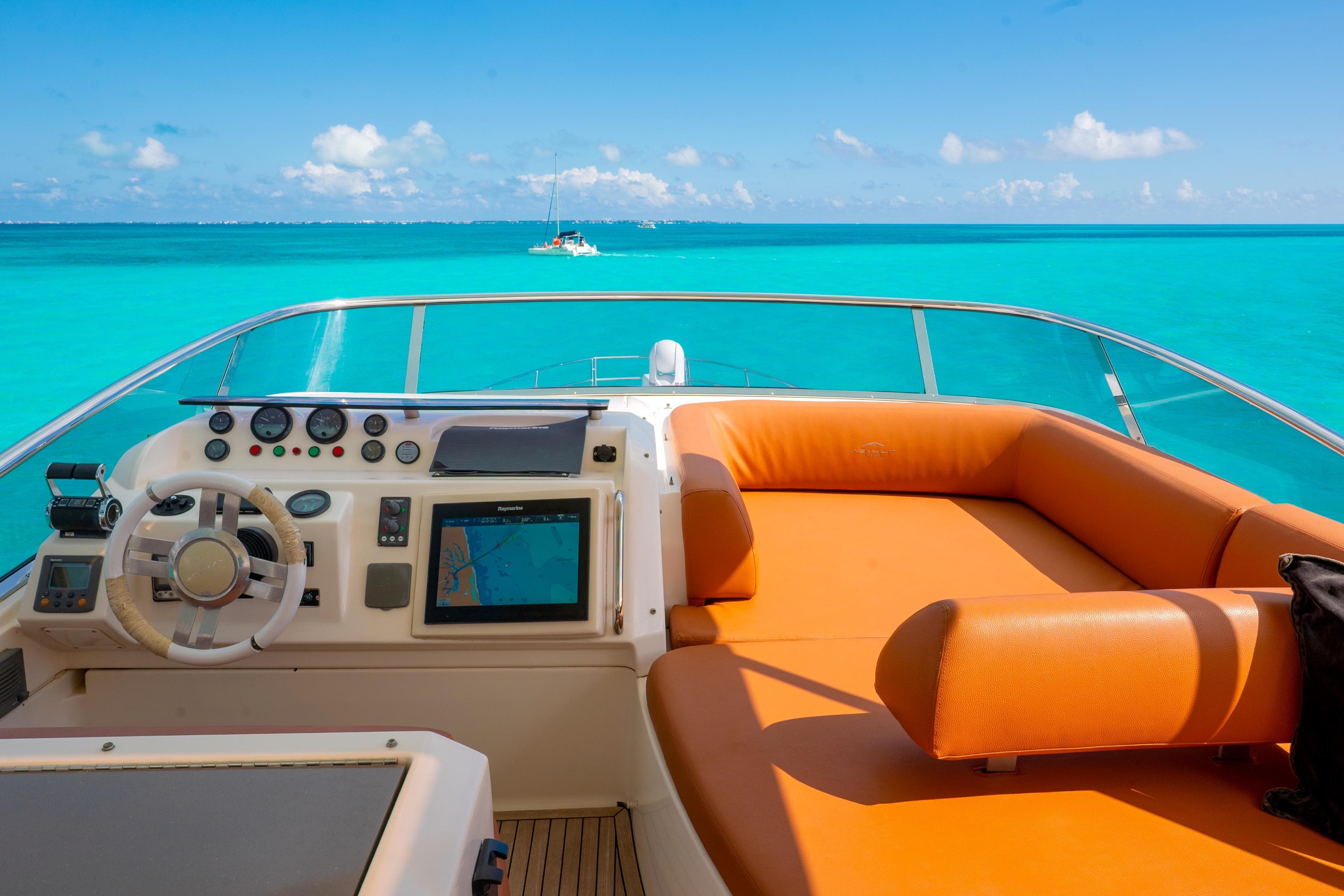 Cockpit view of 2011 Azimut 58 yacht with turquoise ocean backdrop.
