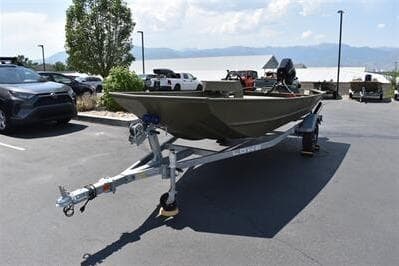 2025 Lowe L1652MT Jon boat on trailer in parking lot, sunny day.