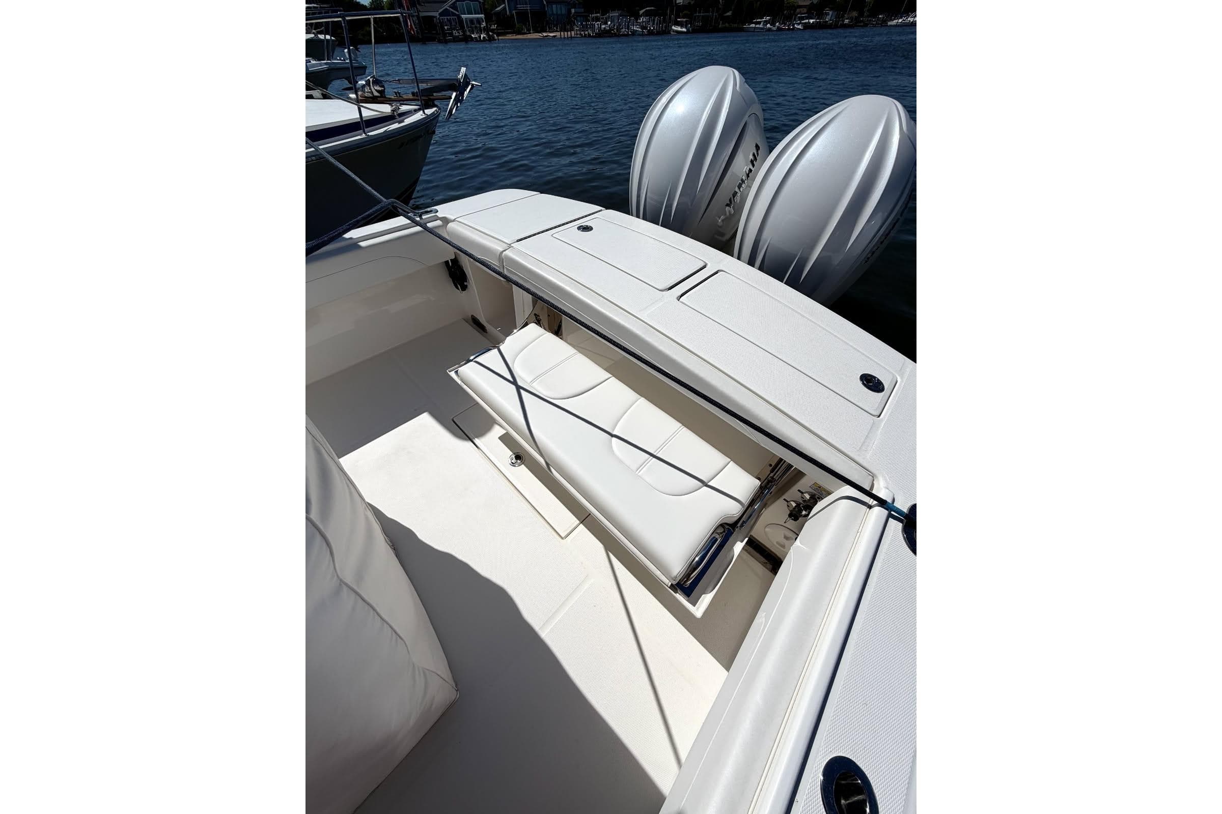 2023 Regulator 28 boat interior with seating and dual outboard motors.