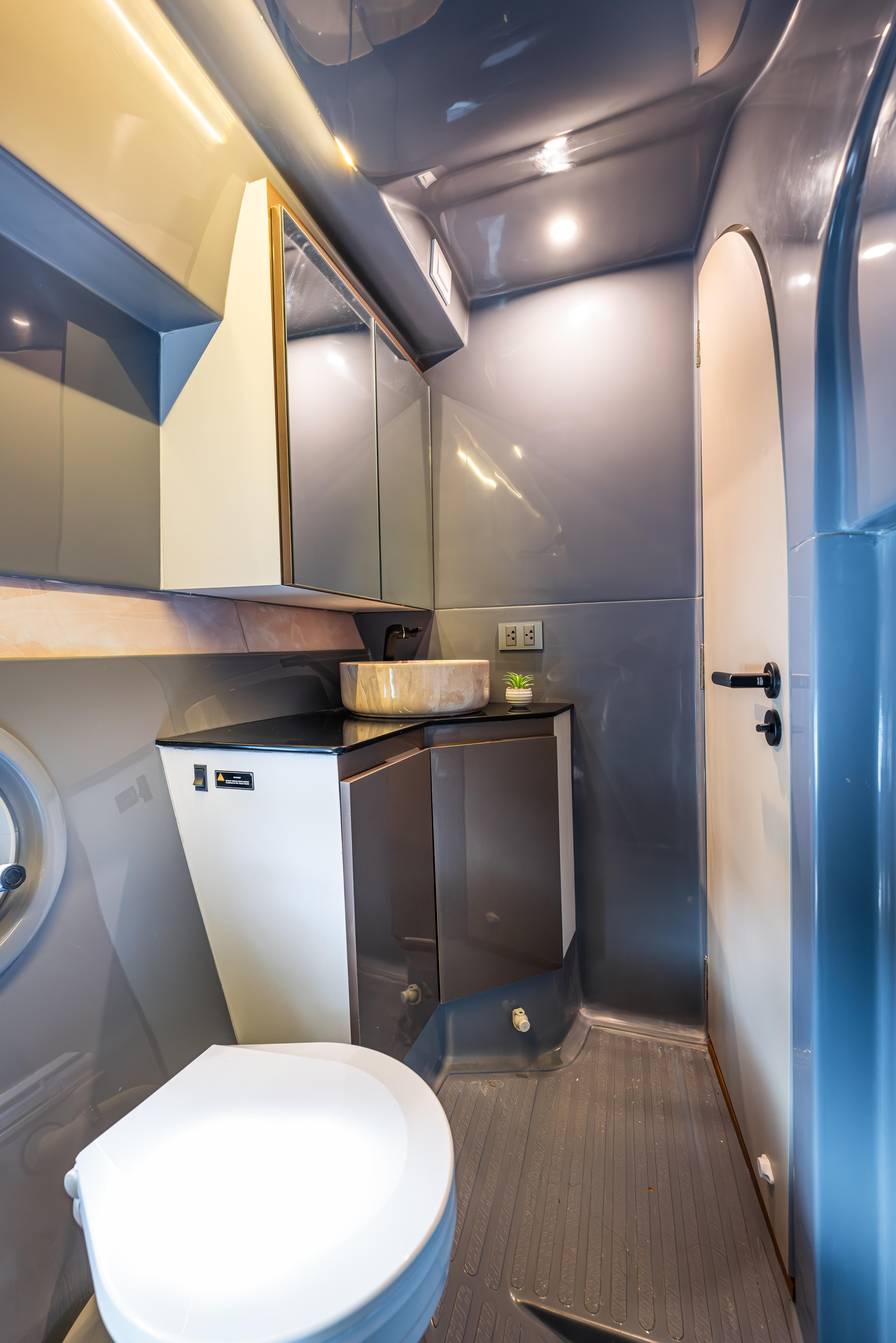 Modern bathroom interior in Hanover 415, 2025 model, featuring sleek design and compact fixtures.