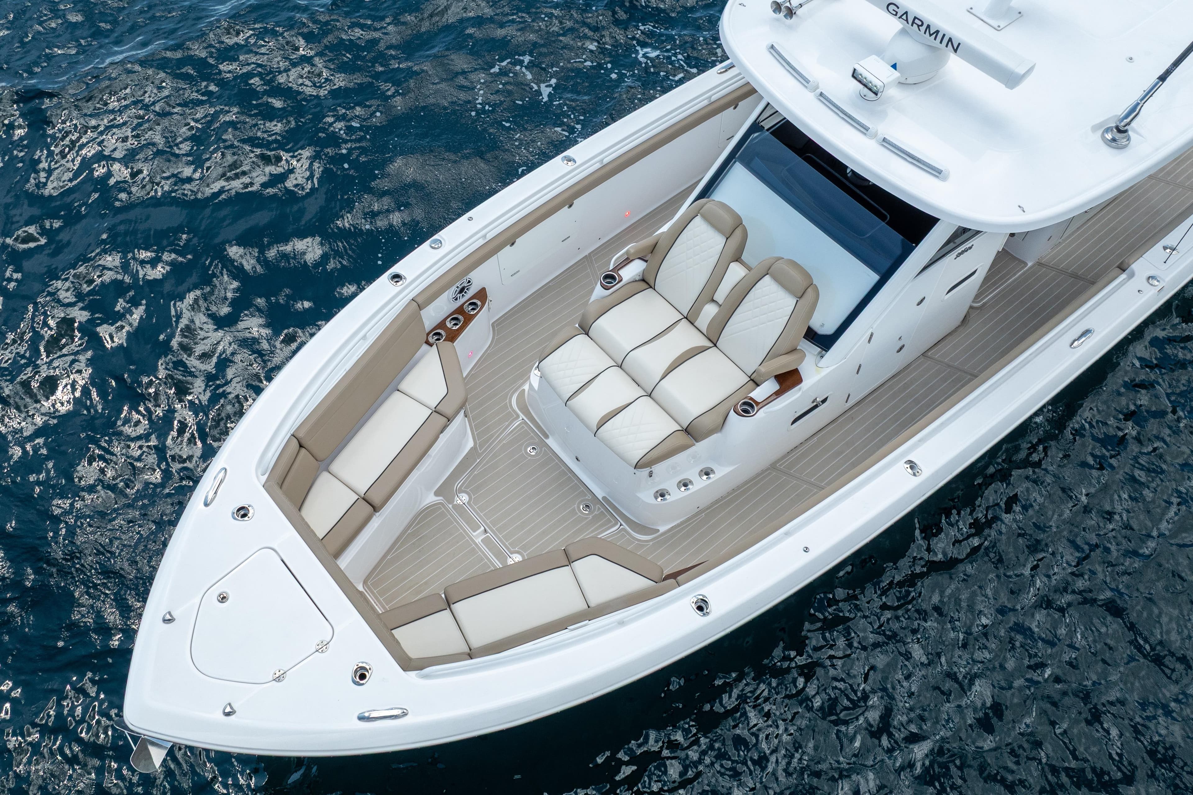2021 Everglades 395 Center Console boat on water, featuring luxurious seating and sleek design.