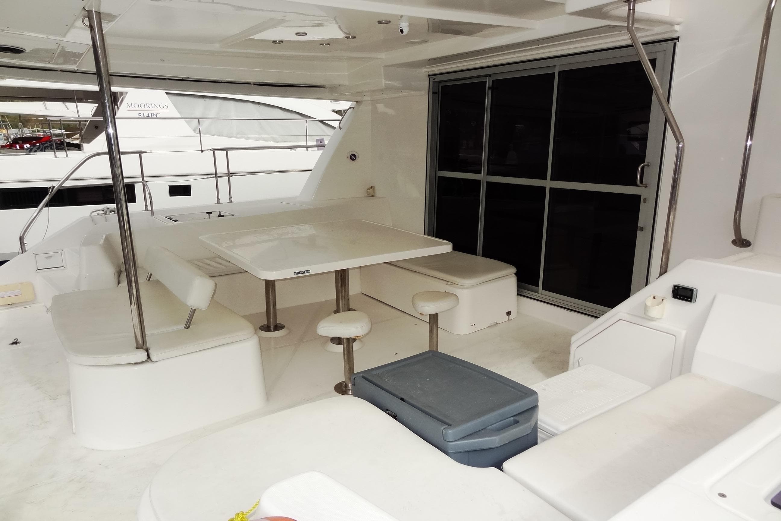 2016 Leopard 51 Powercat yacht interior with seating and table on deck.