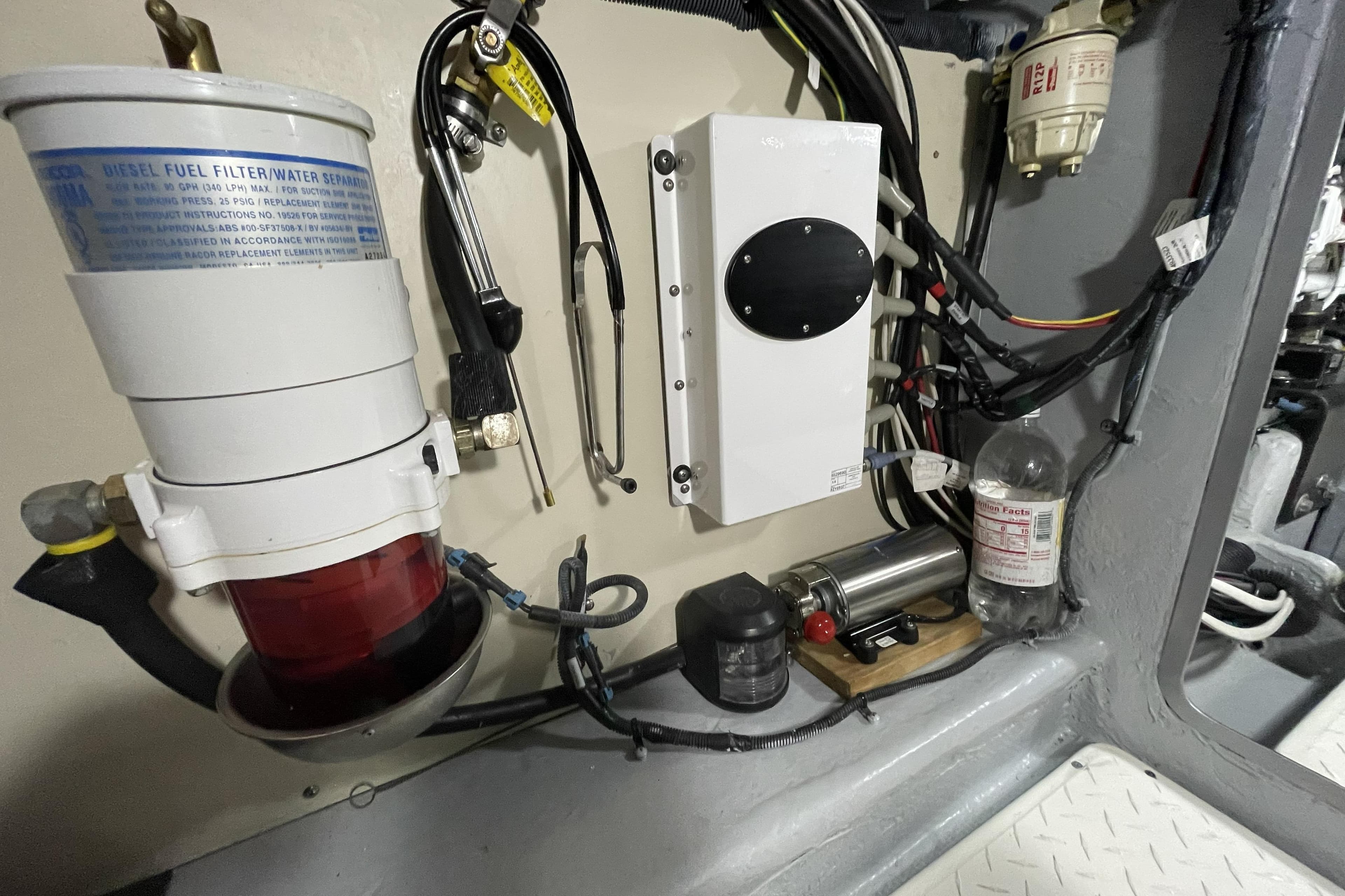 Engine room of 2008 Meridian 490 Pilothouse with fuel filter and wiring.