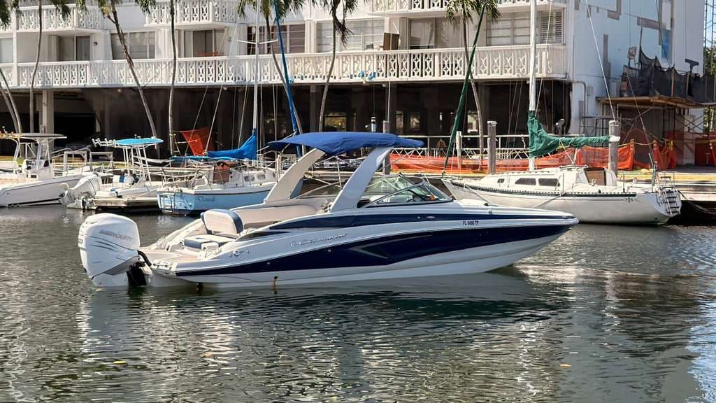 2023 Crownline Eclipse E285 XS boat docked in harbor.