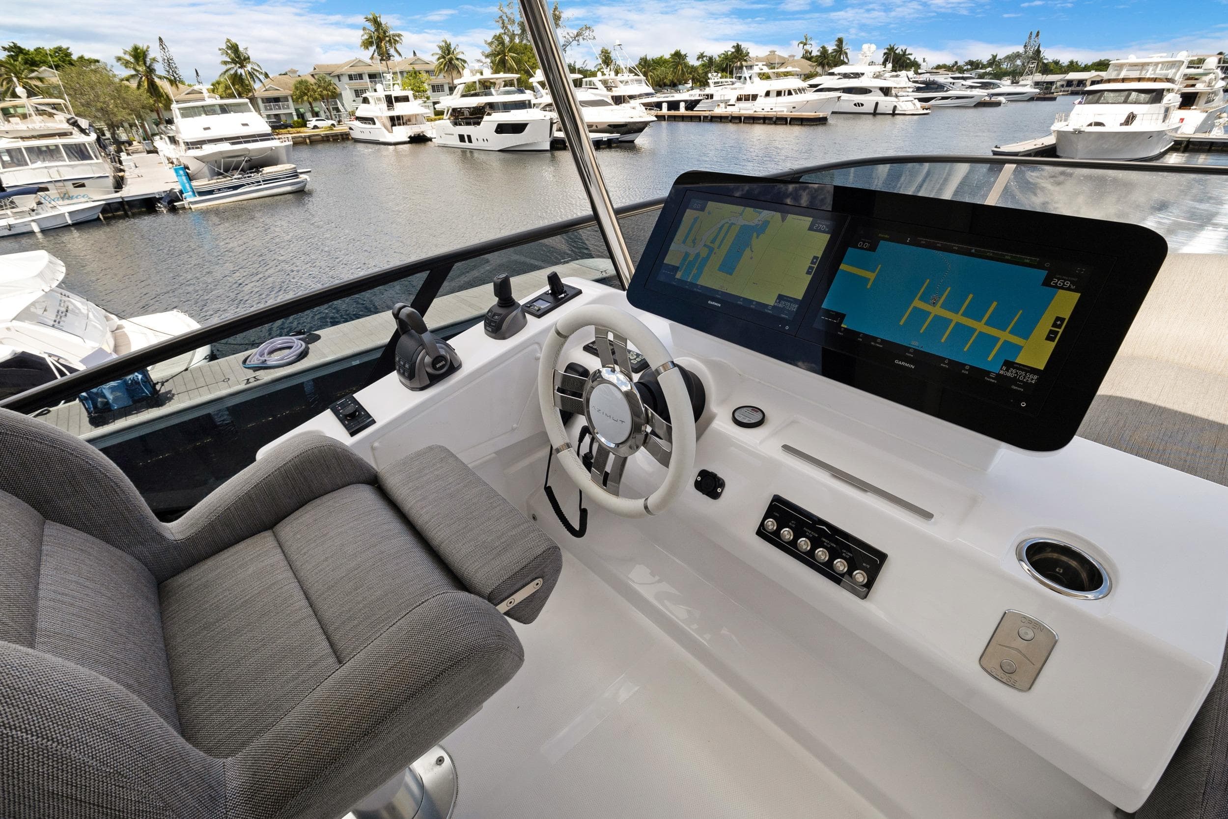 2024 Azimut Fly 53 yacht helm with modern navigation displays and luxurious seating.