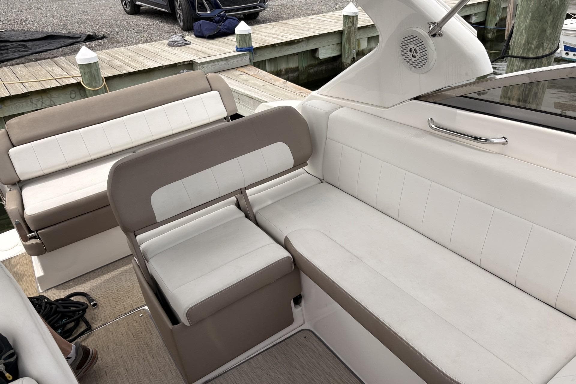Interior seating of a 2016 Regal 30 Express boat at a dock.