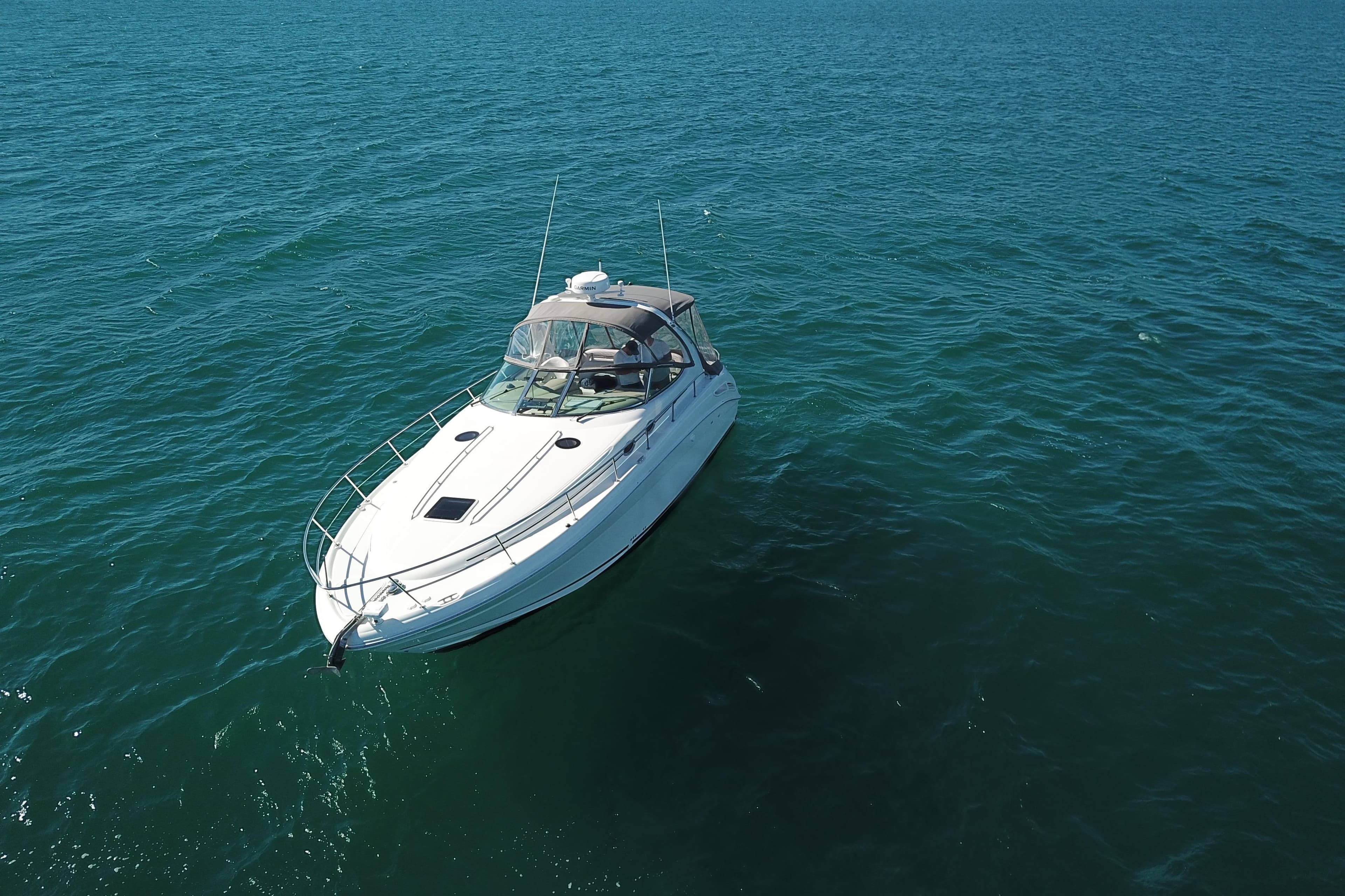 2005 Sea Ray 360 Sundancer yacht cruising on open blue waters.