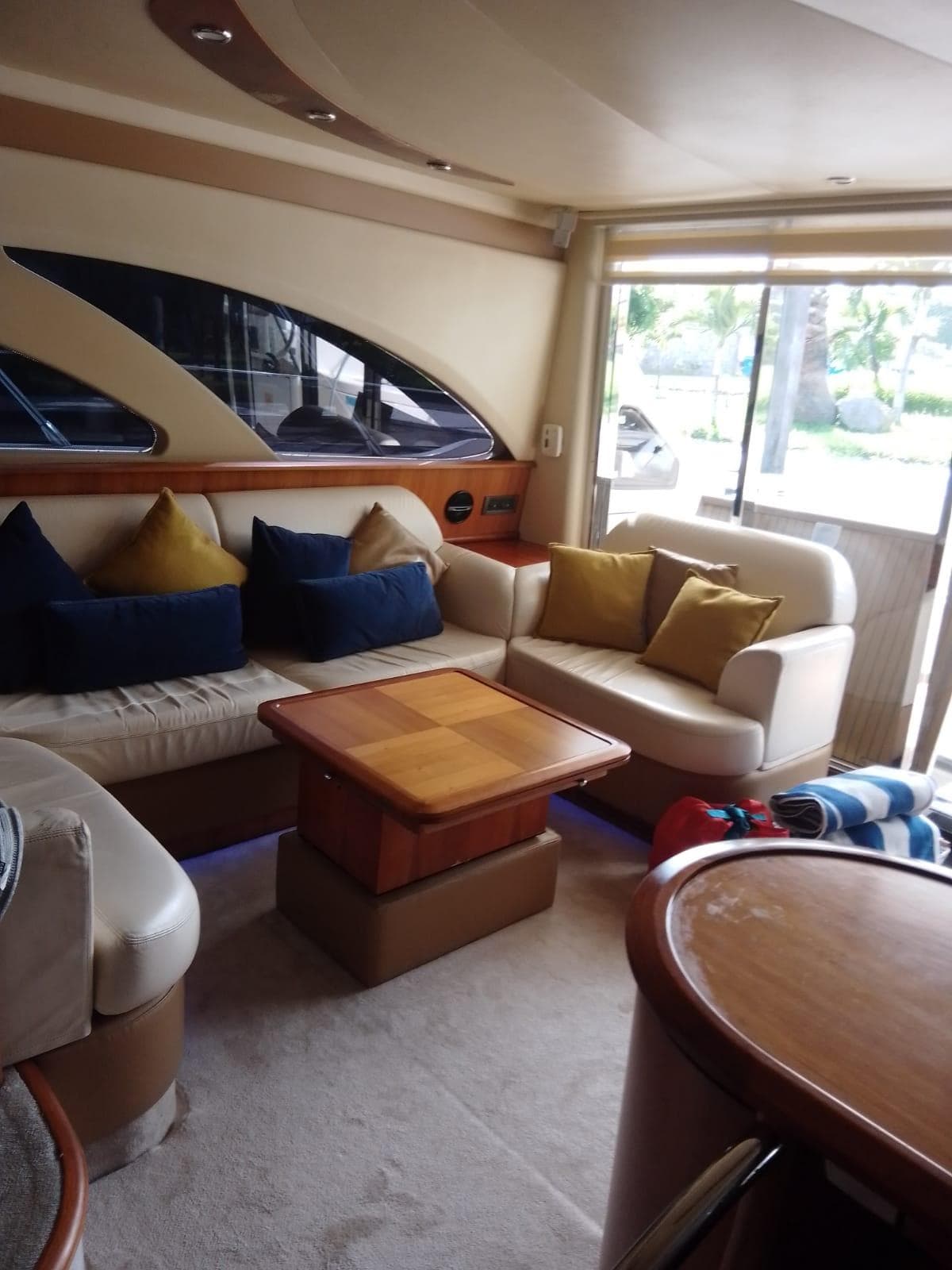 Luxurious interior of a 2008 Azimut Flybridge yacht with plush seating and elegant decor.