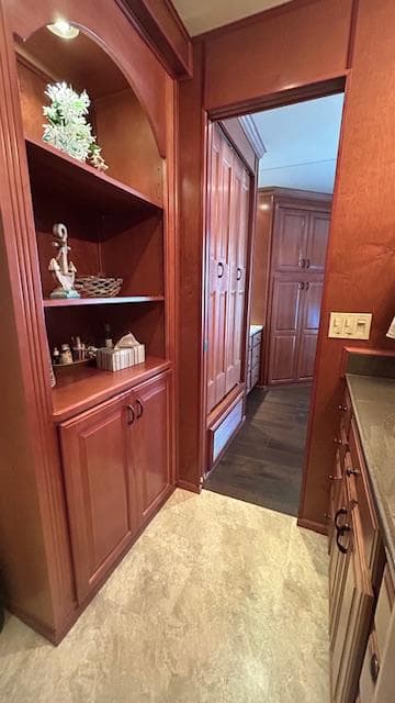 Luxurious wood interior of a 2007 Sharpe 18 x 85 houseboat with elegant cabinetry.