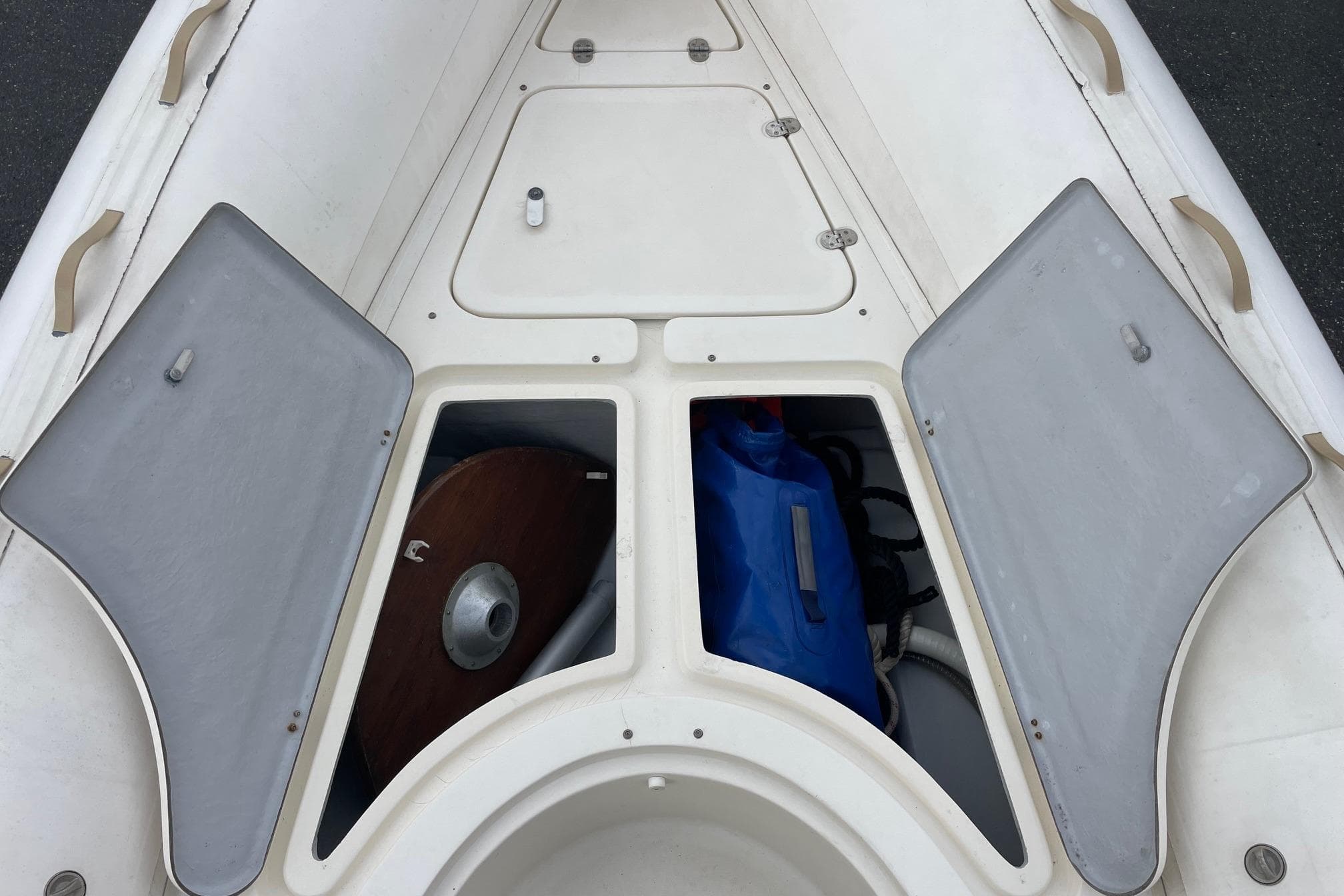Open storage compartments on a 2008 Nuova Jolly King 670 boat deck.