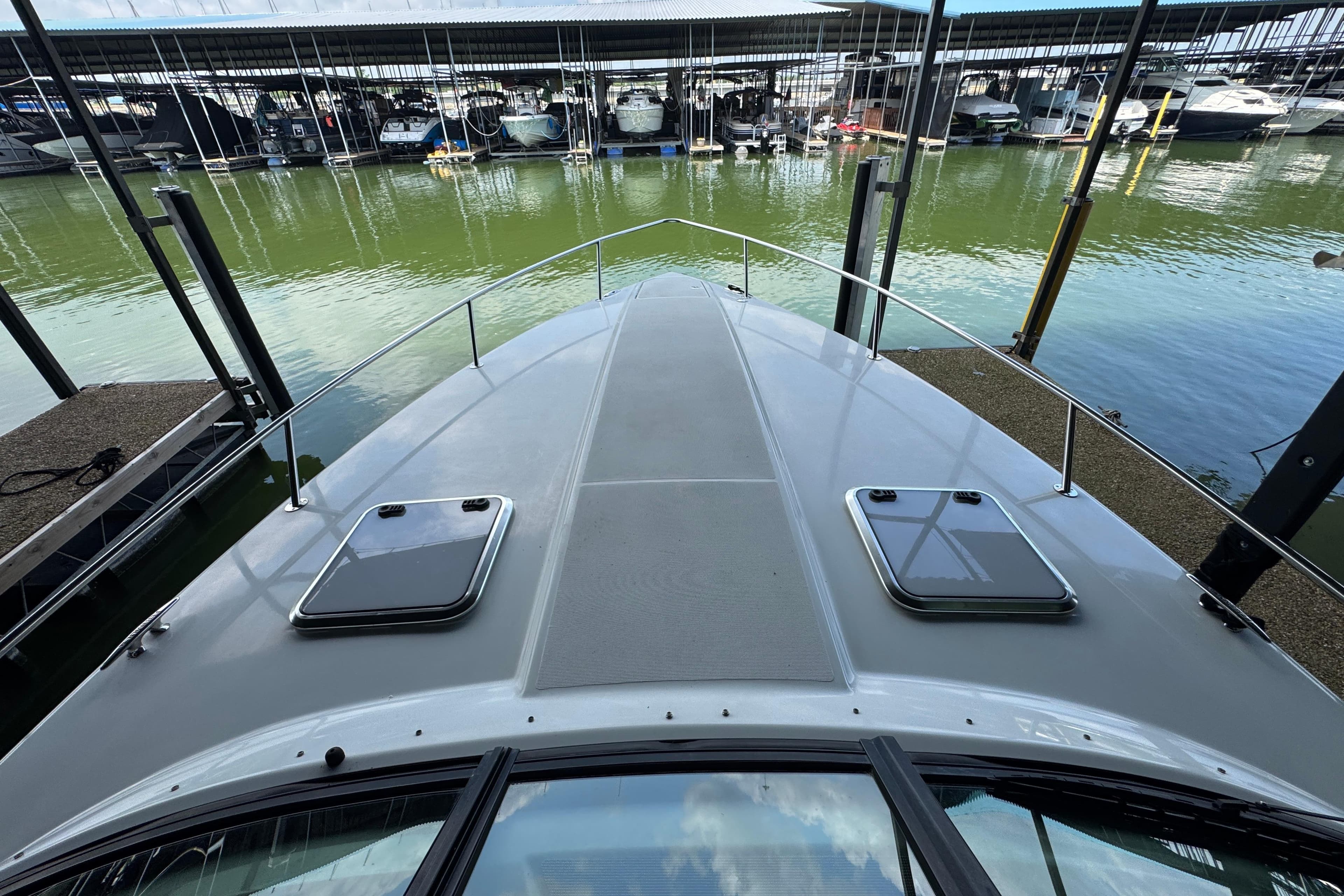 2008 Formula 350 Sun Sport boat docked at marina, view from bow.