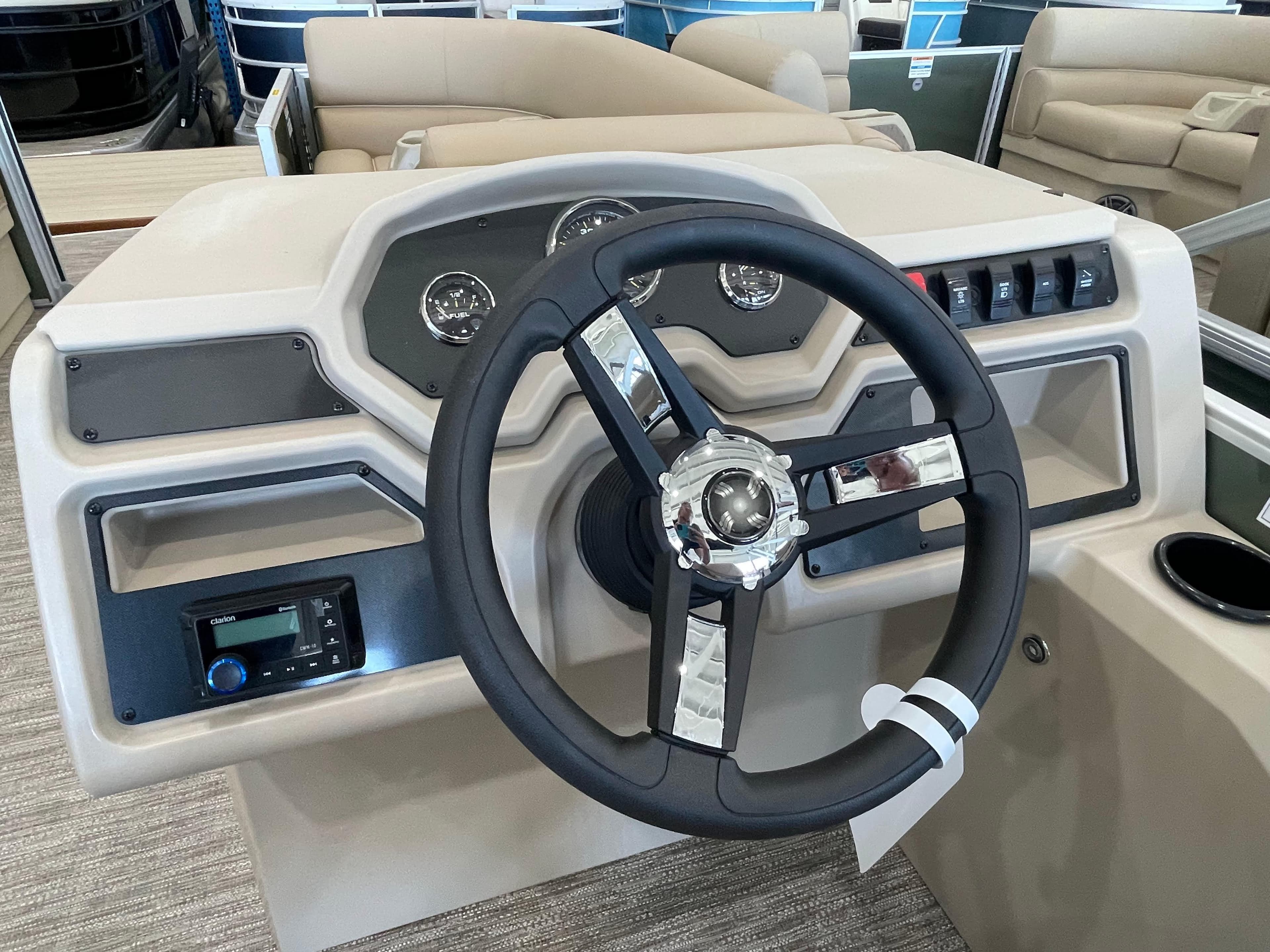 Steering console of 2026 Godfrey Xperience 2086 CX pontoon boat with modern controls.
