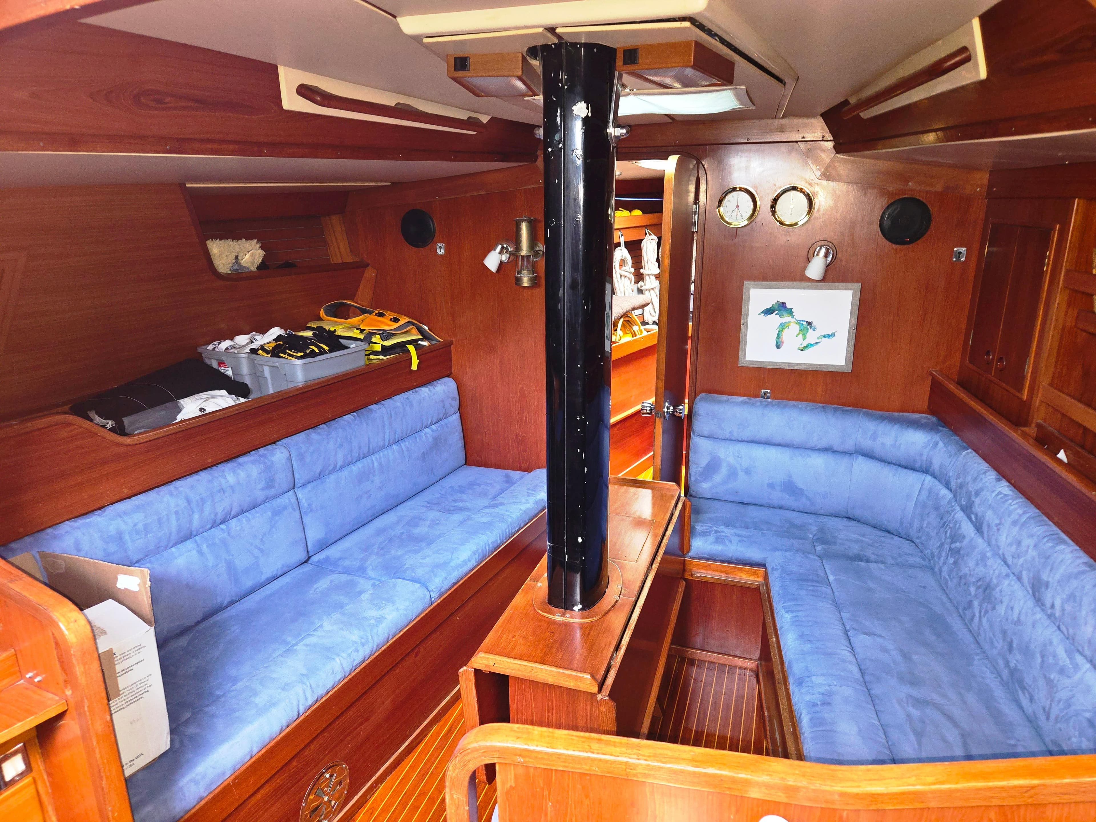 Interior of a 1982 Baltic 42 yacht with blue upholstery.