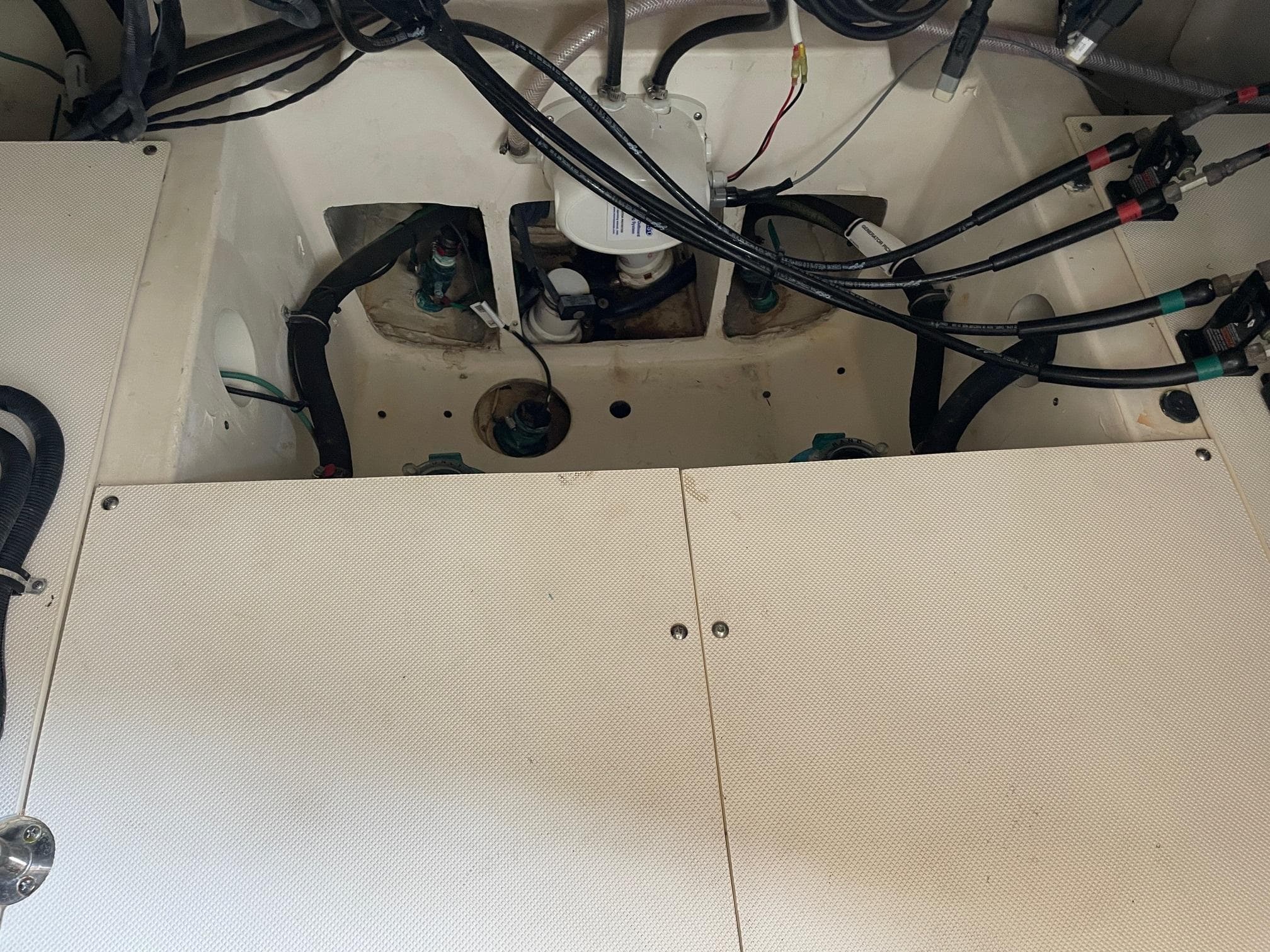 Engine compartment of 2014 Pursuit SC 365i Sport Coupe with visible wiring and components.