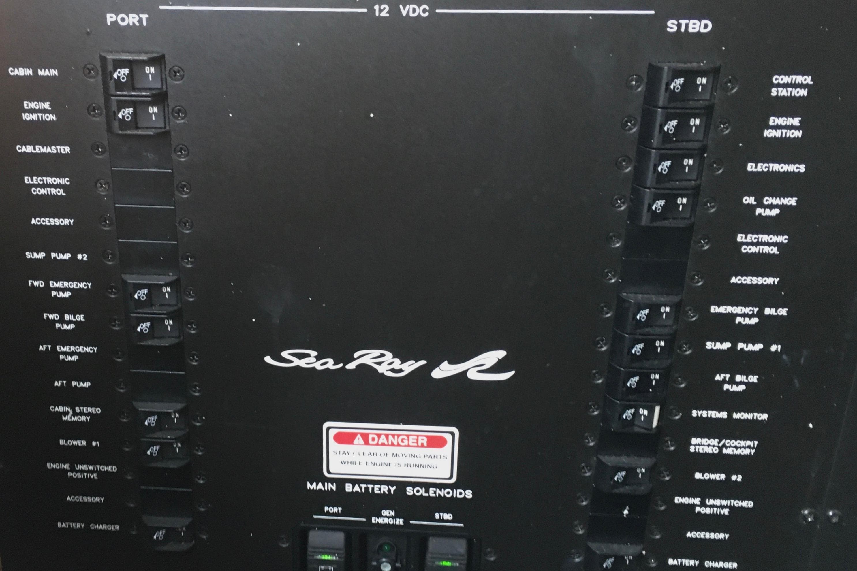 Control panel of a 2005 Sea Ray 420 Sundancer boat with labeled switches.