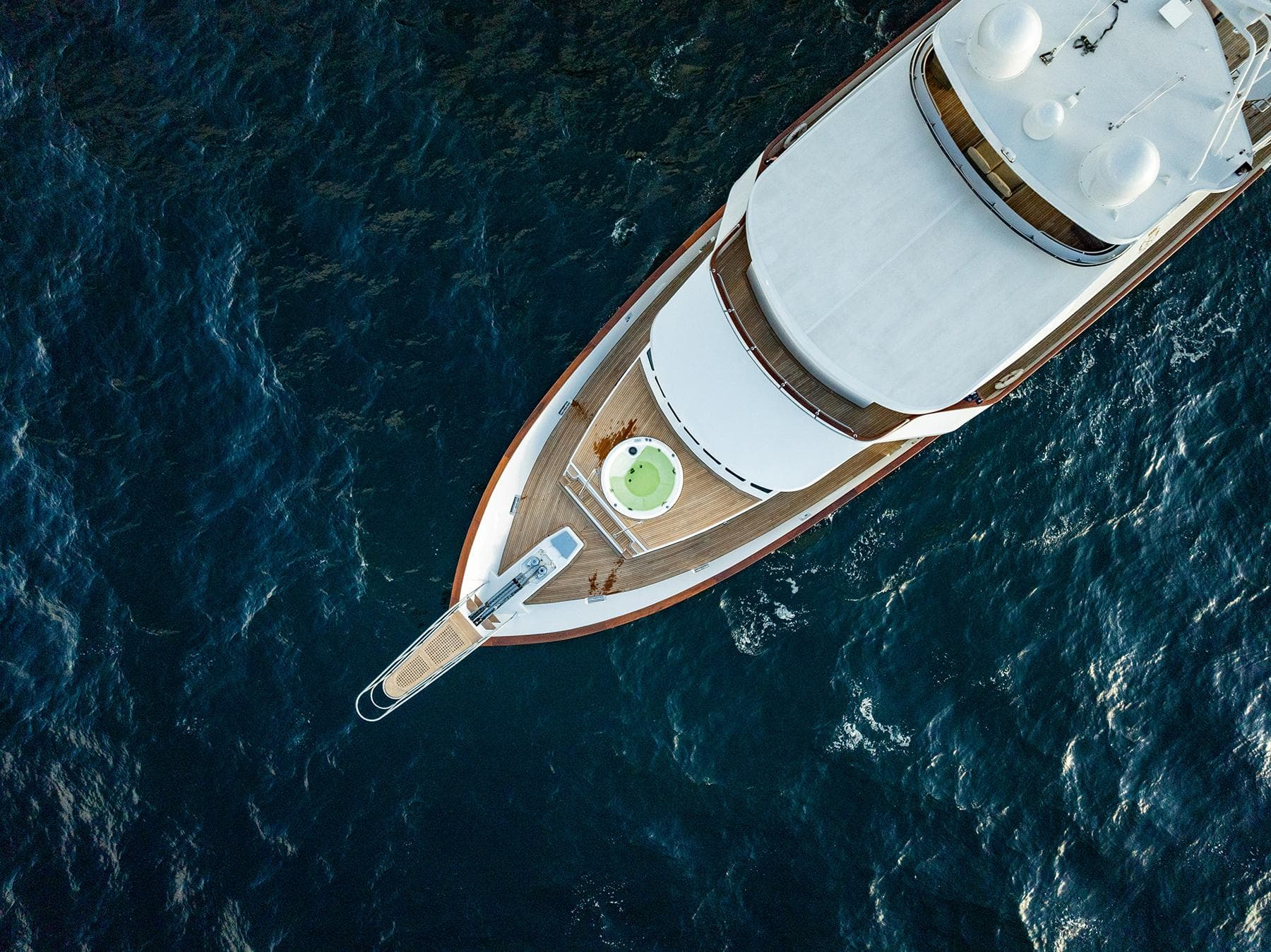Aerial view of a 2009 Custom Crystal Motoryacht on open sea.