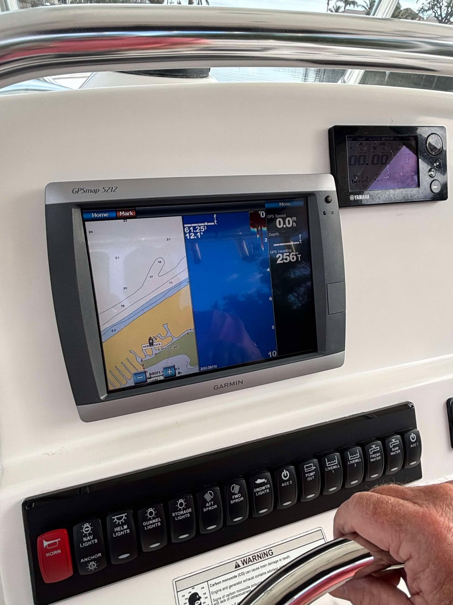 Edgewater 318CC 2012 boat dashboard with navigation and control panels.