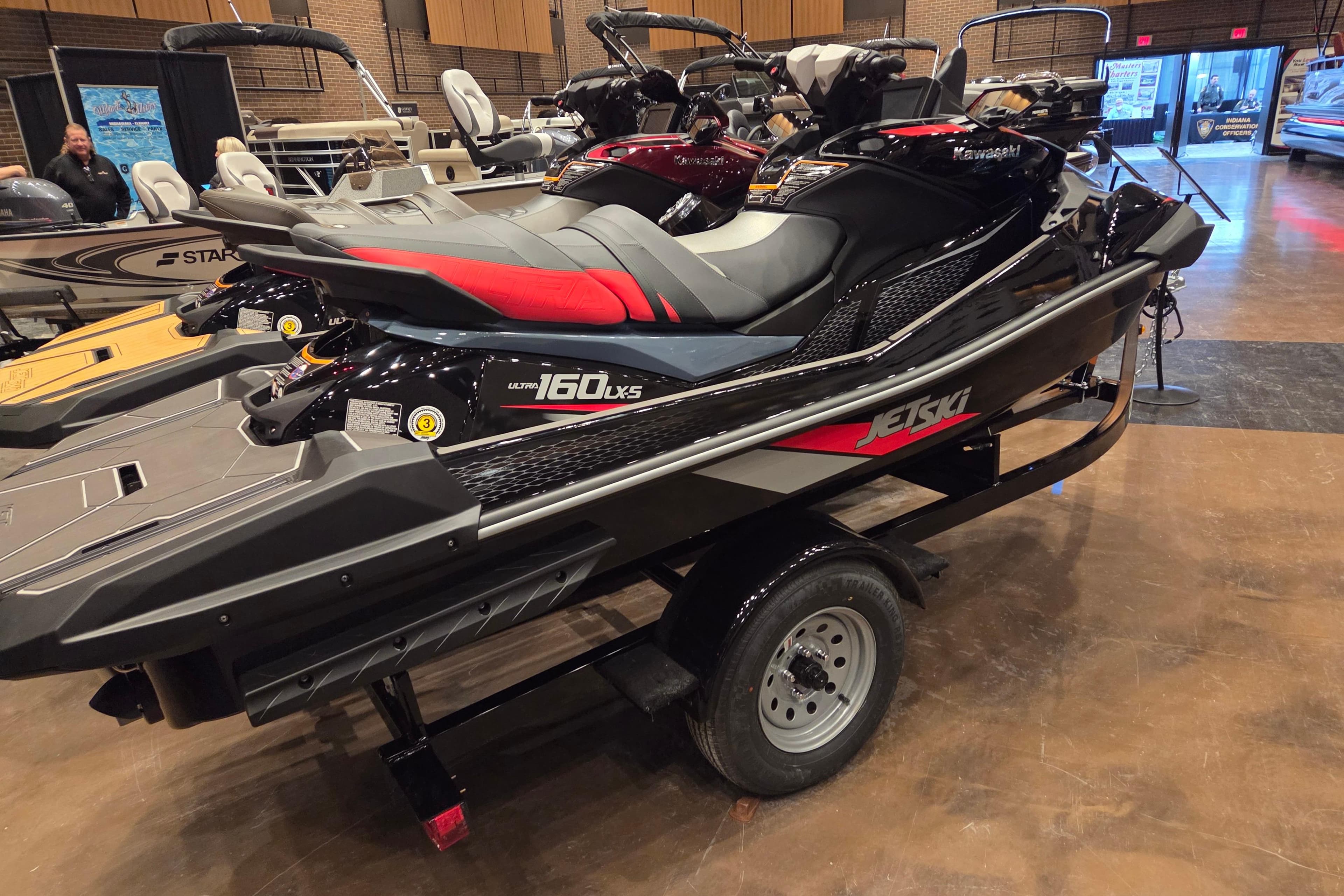 2026 Kawasaki ULTRA 160LX-S jet ski on display in showroom.