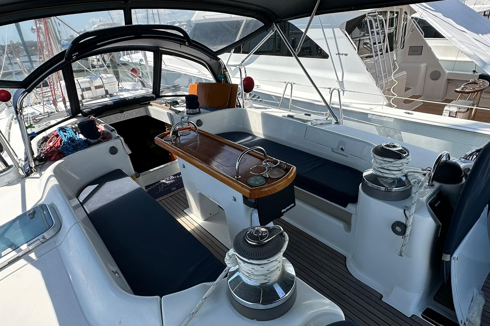 Cockpit of a 2000 Beneteau 50 sailboat, featuring seating and winches.
