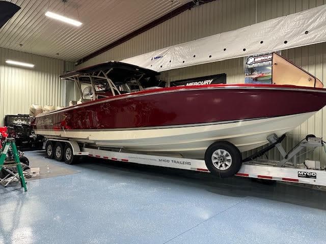 2020 Nor-Tech 390 Sport Center Console boat on Myco trailer in indoor storage.