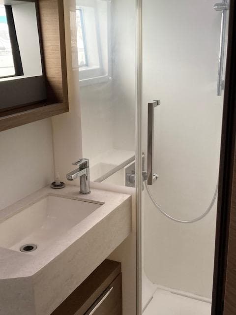 2018 Lagoon 50 yacht bathroom with modern sink and shower.
