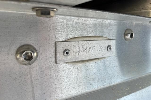 Close-up of a 2020 Manitou 25 OASIS SL VP serial number plate on metal surface.