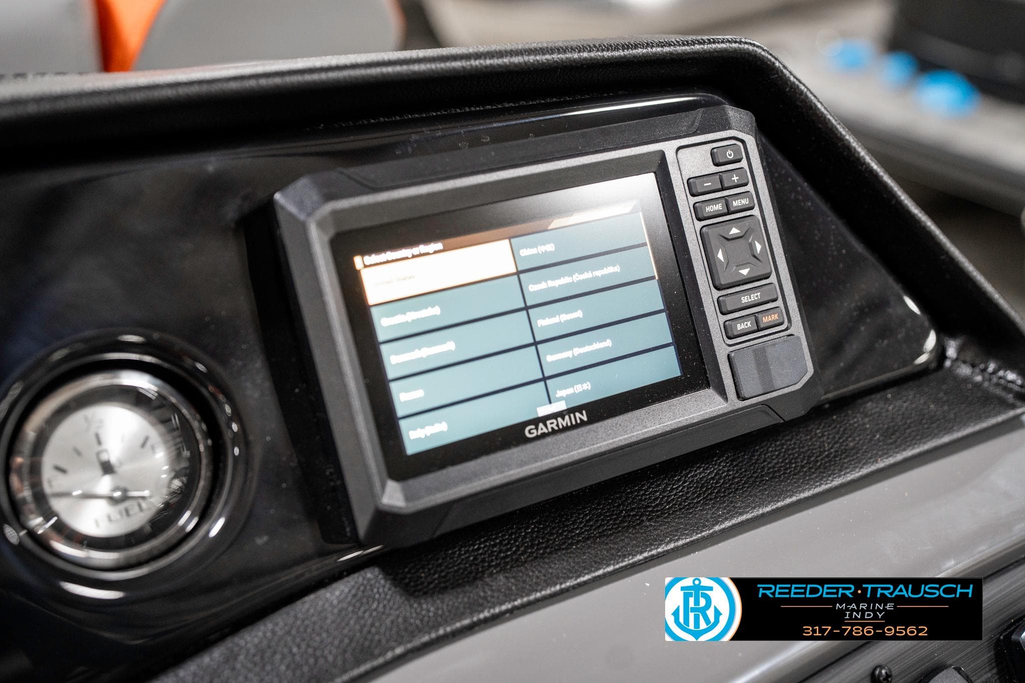 Garmin display on 2025 Bennington 21 SSR boat dashboard with clock and controls.