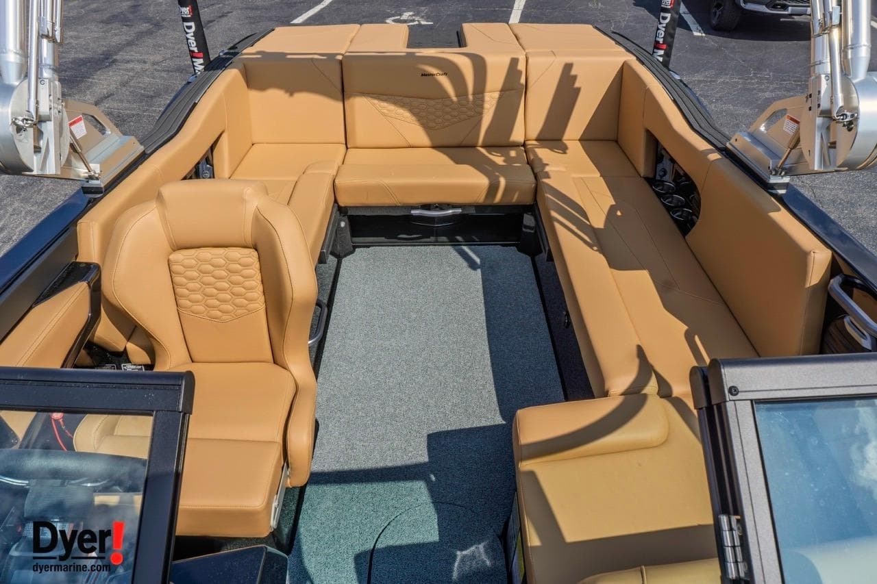 2026 MasterCraft NXT22 boat interior with tan seating and modern design.