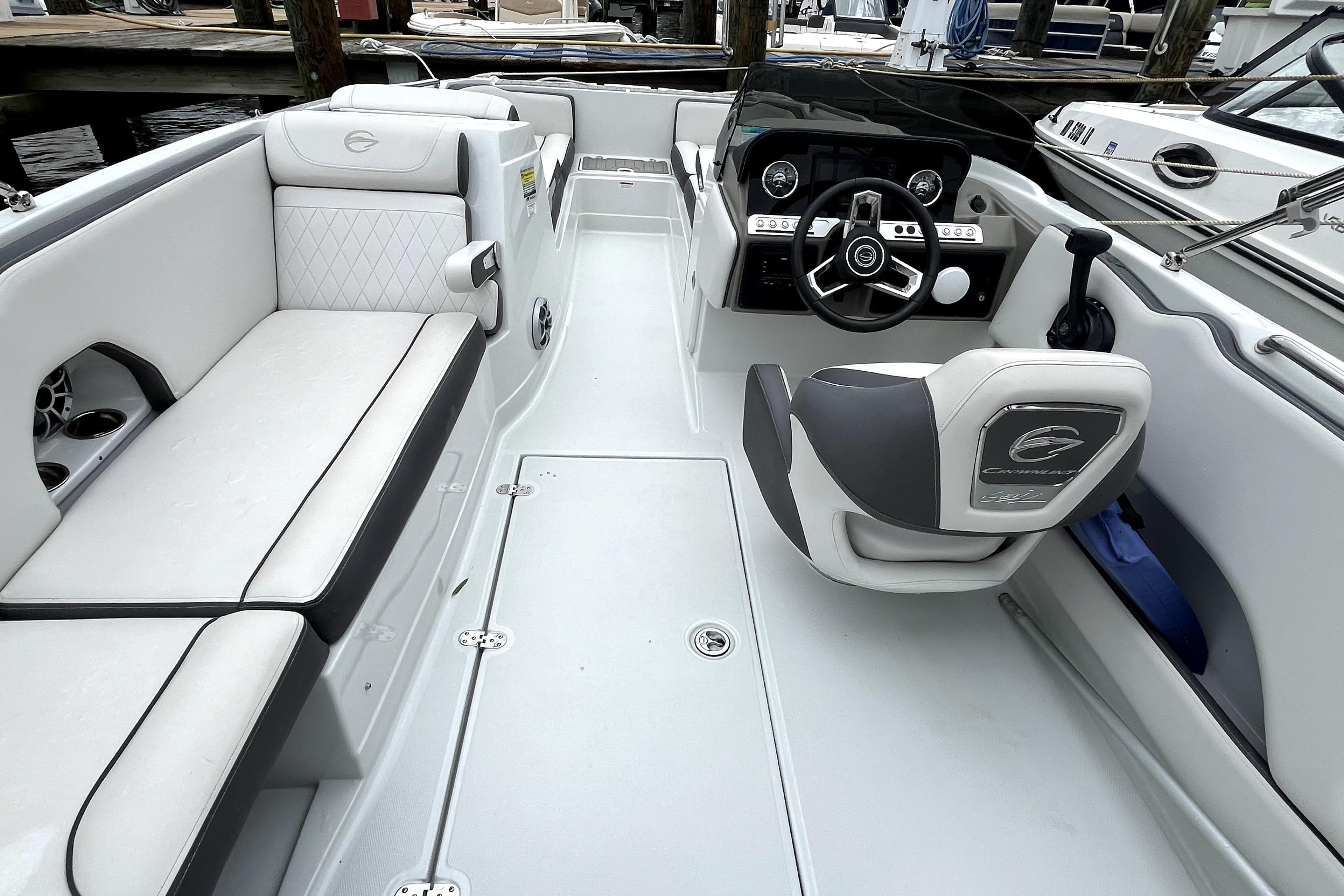 2024 Crownline Eclipse E230 XS boat interior with sleek seating and modern dashboard design.