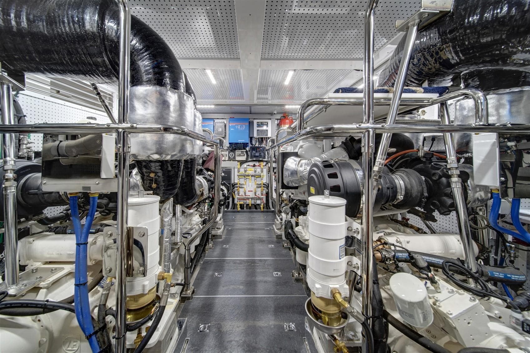 Engine room of 2027 Outer Reef Yachts 740 Deluxbridge Motoryacht, showcasing advanced machinery and systems.