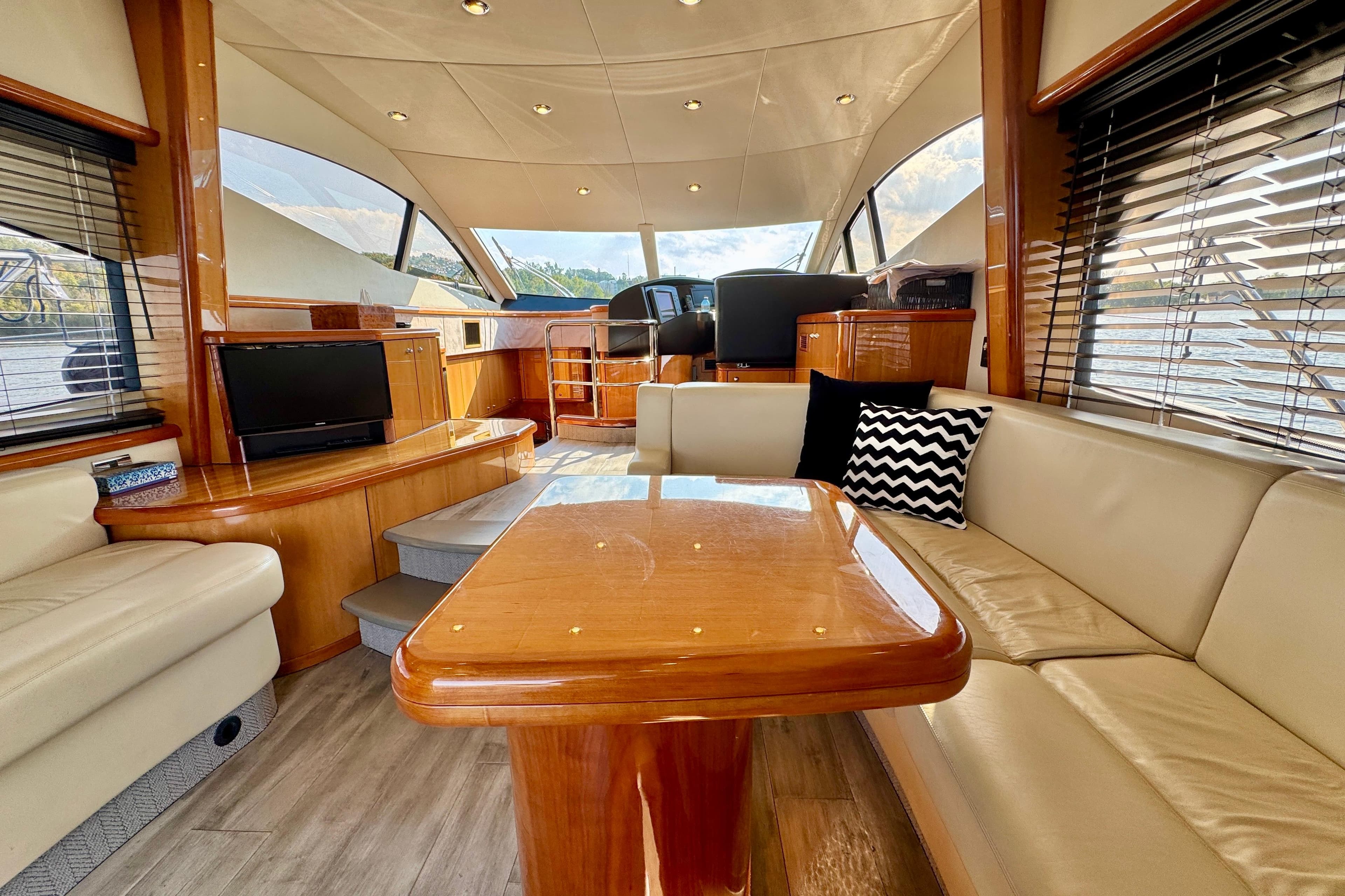 Luxurious interior of 2005 Sunseeker Manhattan 50 yacht with elegant wood finishes.
