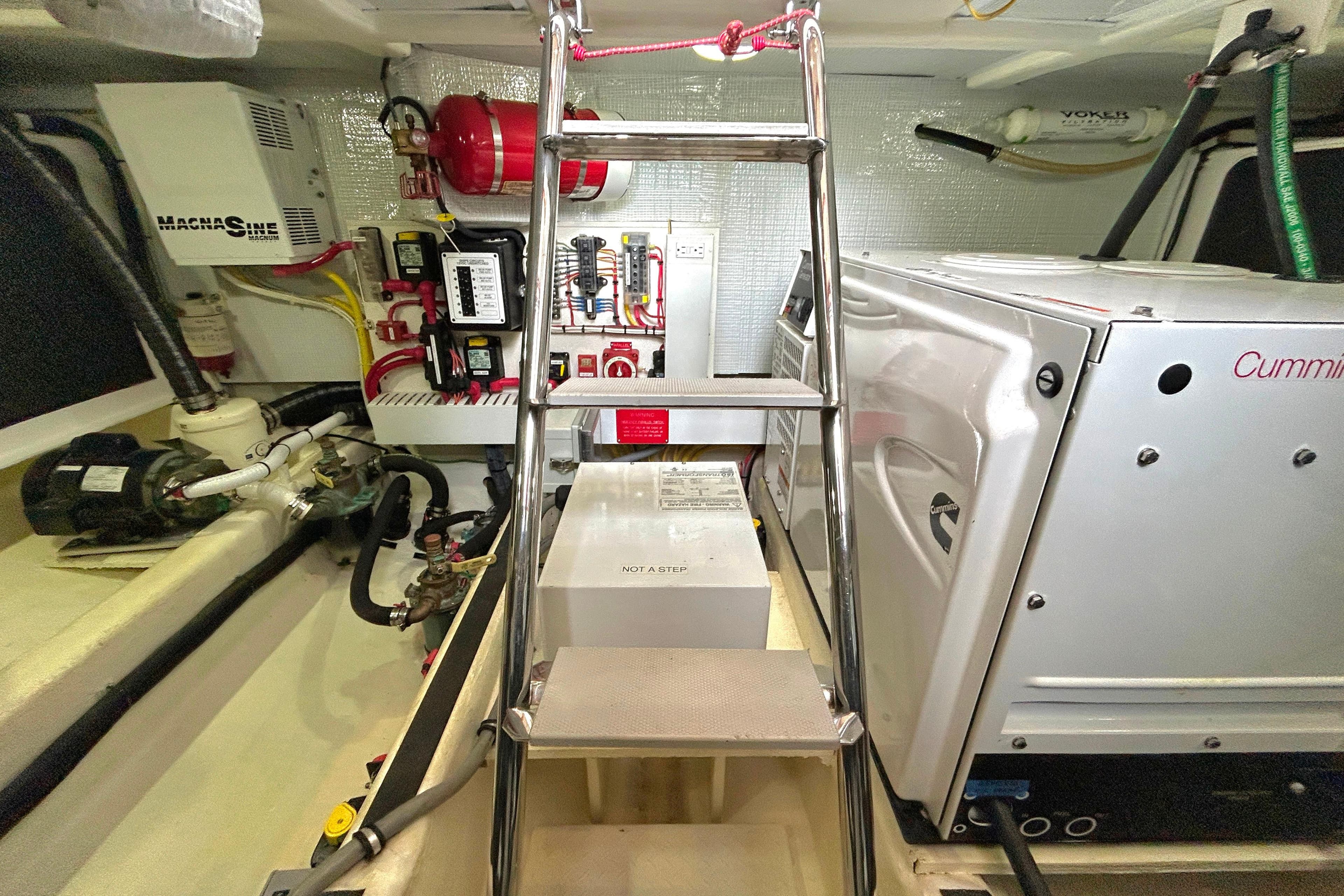 Engine room of 2017 Sabre 42 Salon Express with equipment and ladder.